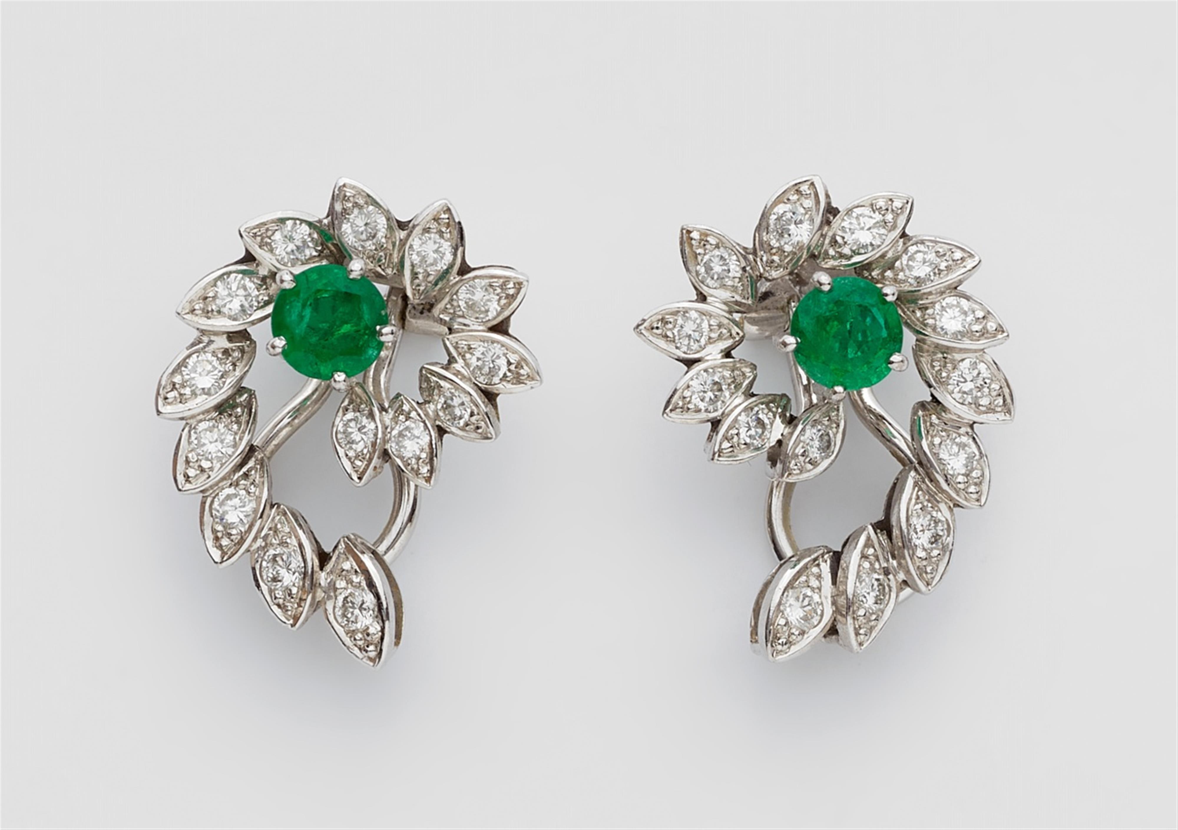 A pair of 14k white gold and emerald clip earrings - image-1