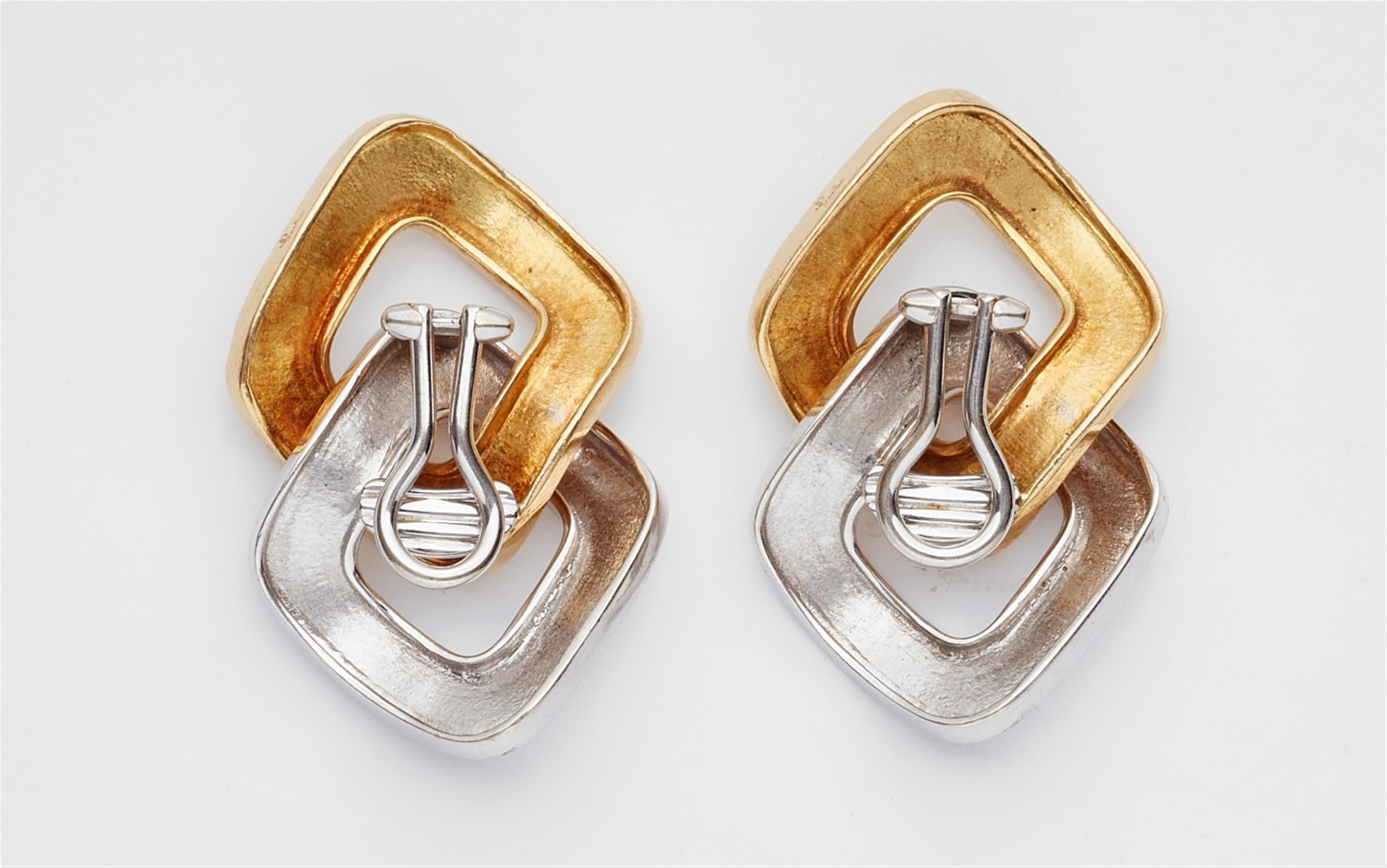 A pair of 18k white and yellow gold earclips - image-2