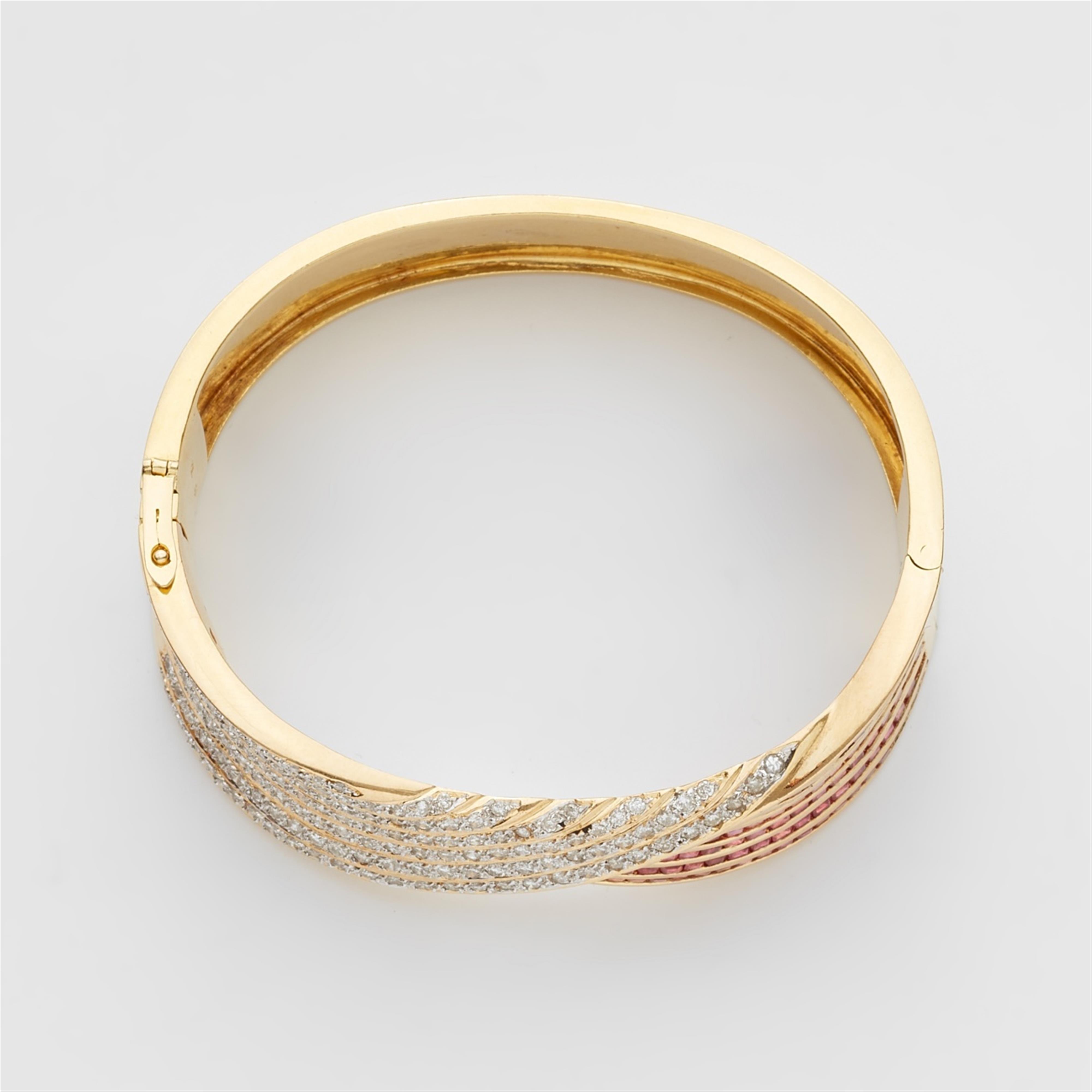 An 18k gold, ruby, and diamond bangle - image-2