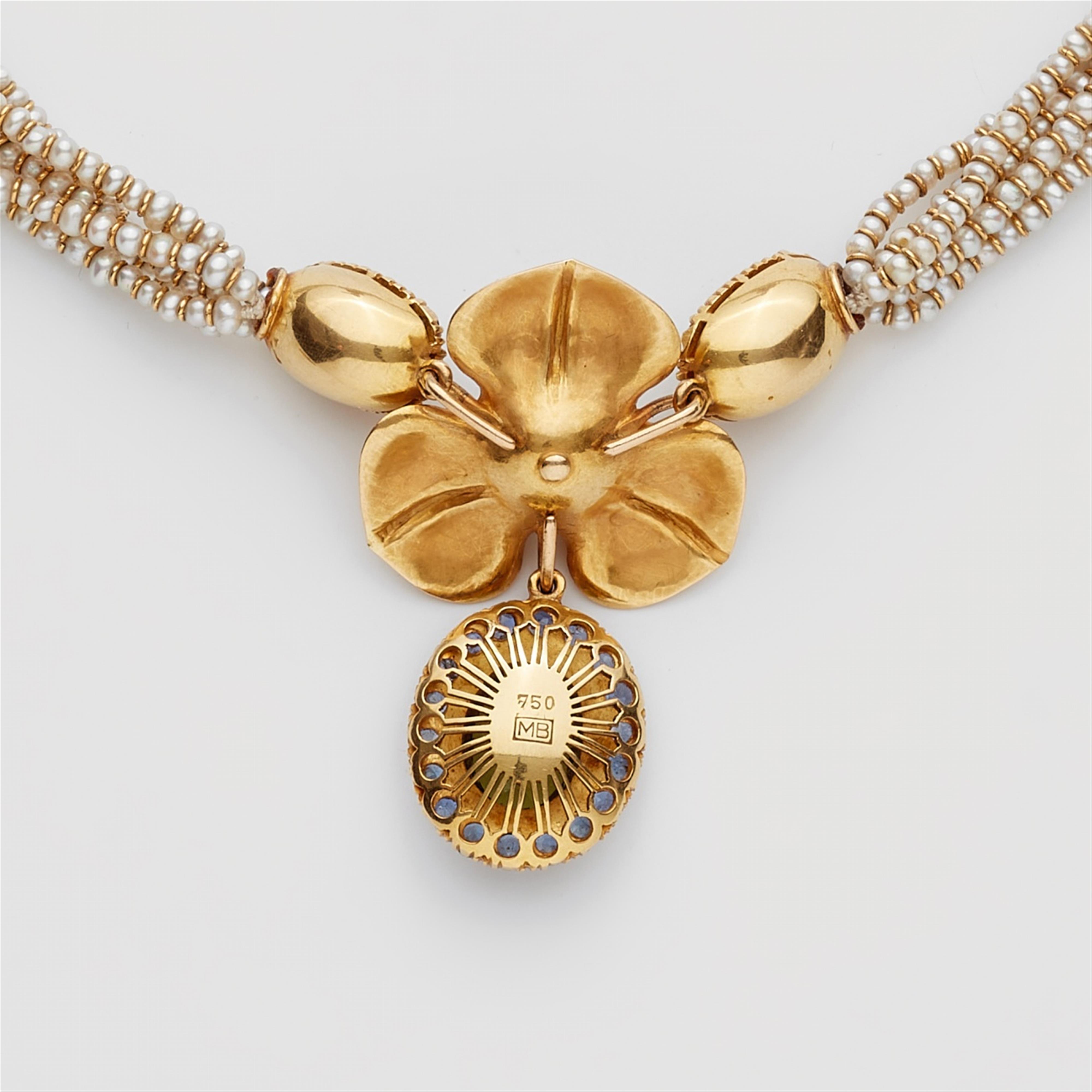 An 18k gold and natural pearl necklace with a coloured stone pendant - image-3