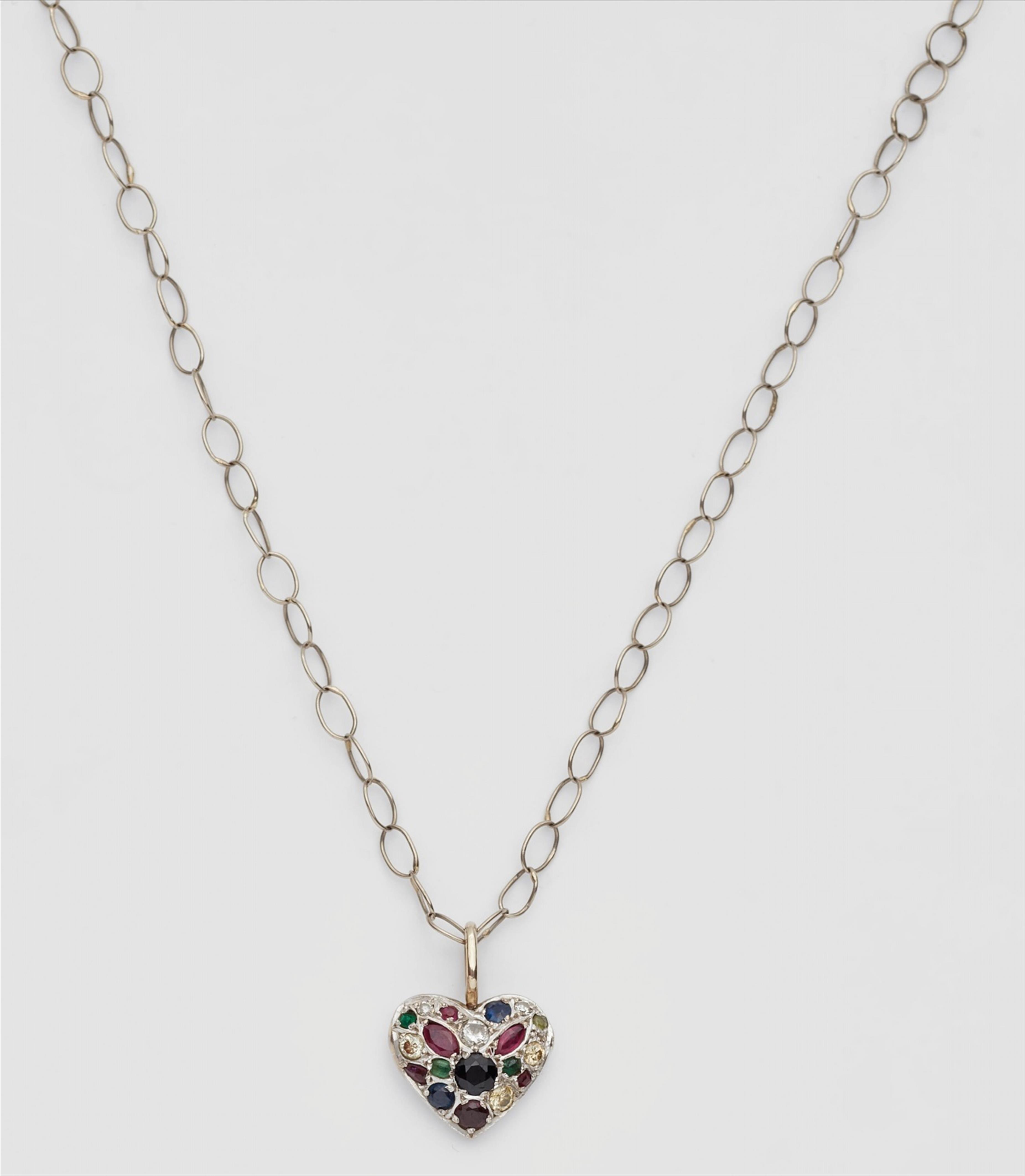 A necklace with a jewelled heart pendant - image-1