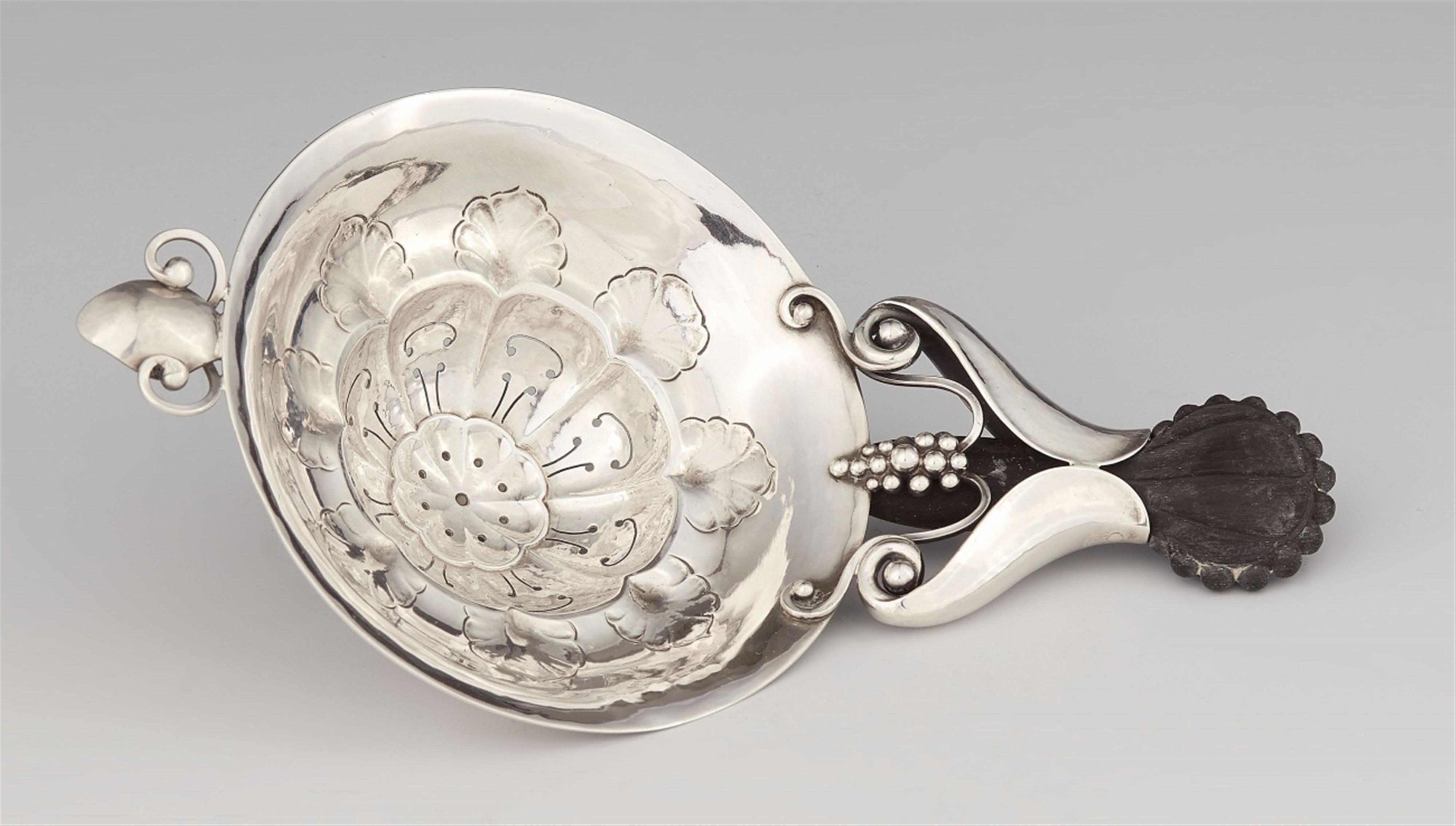 A silver tea strainer by Georg Jensen, model no. 98 - image-1