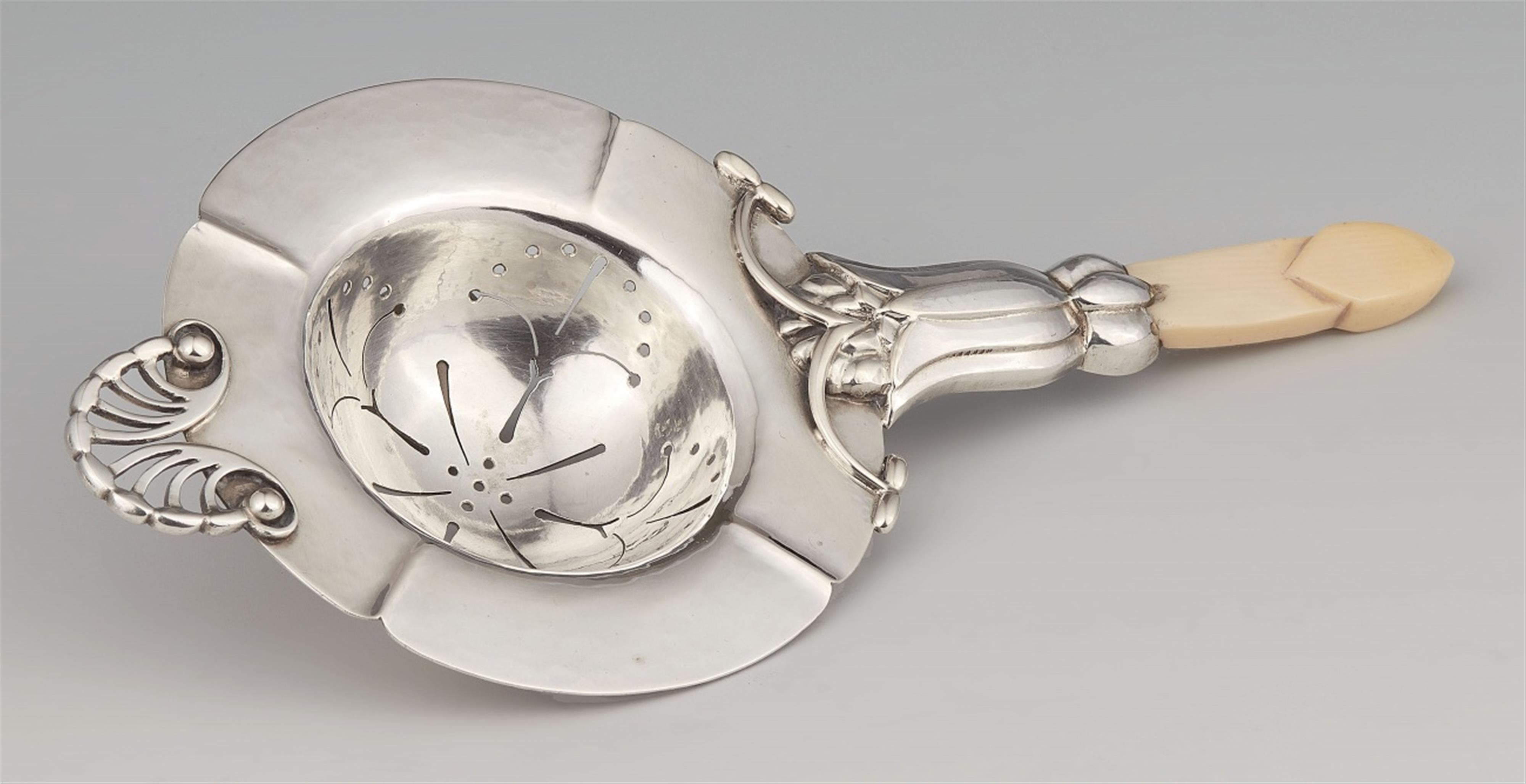 A silver tea strainer by Georg Jensen, model no. 6 - image-1