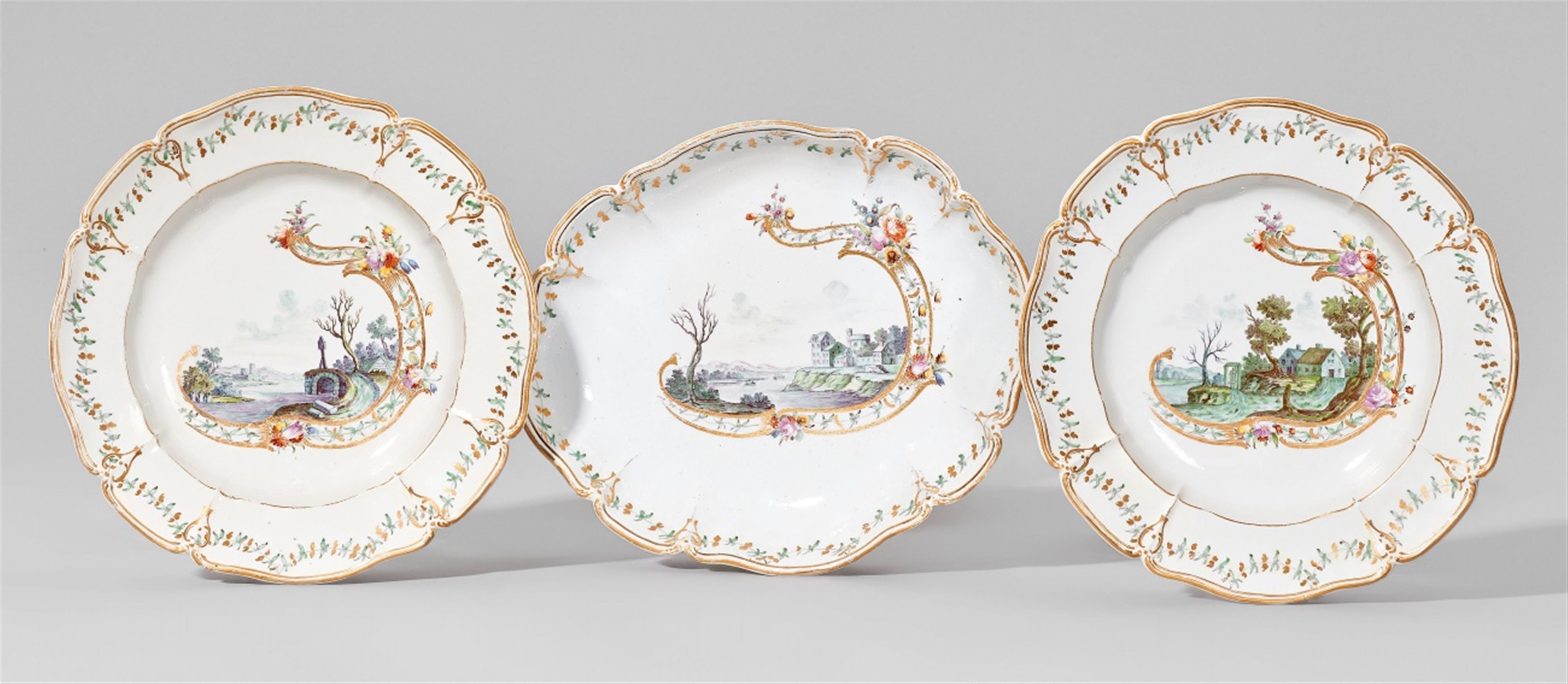 An oval Nymphenburg porcelain dish and two plates with green landscapes - image-1