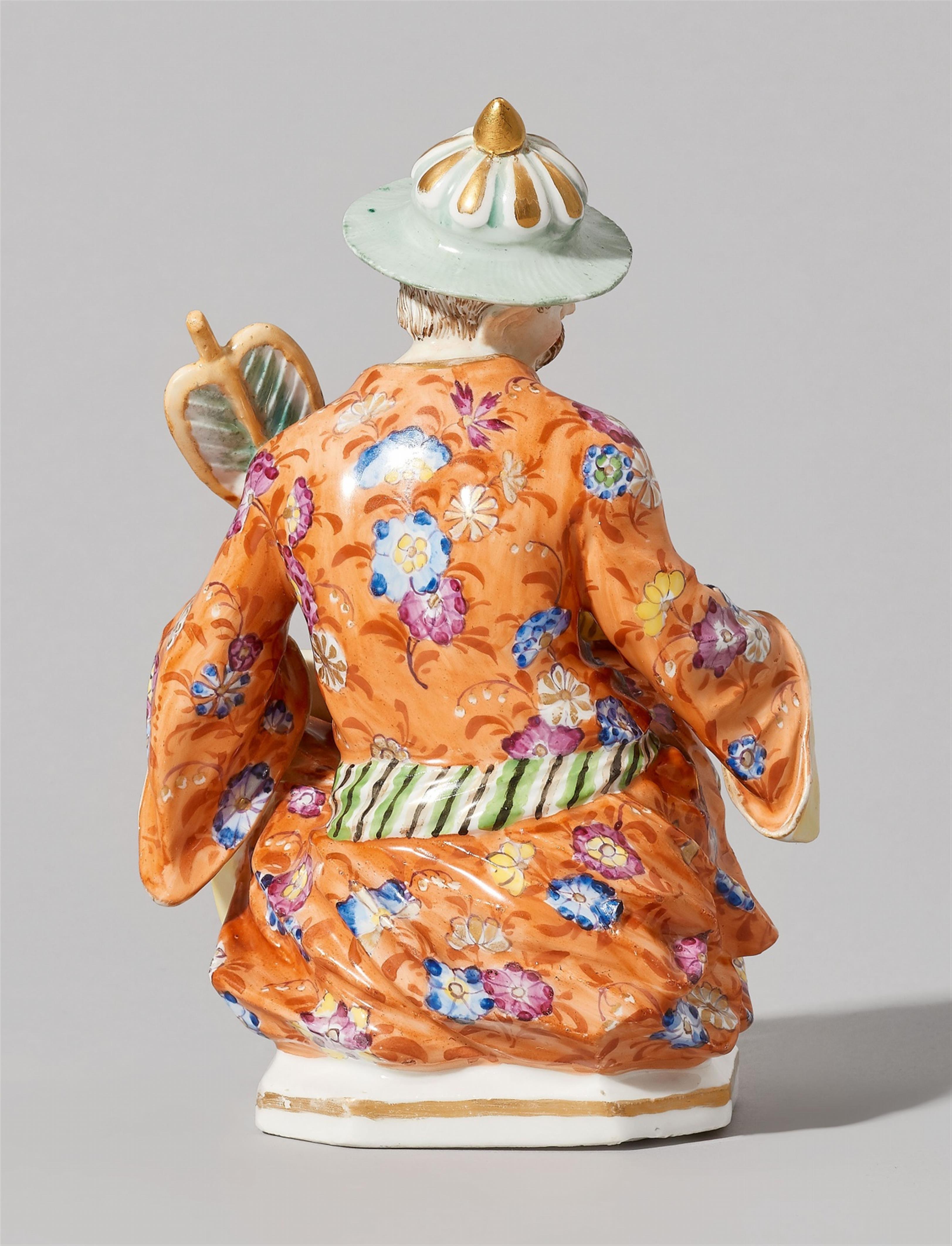 A Meissen porcelain figure of a seated pagode with a parrot - image-2