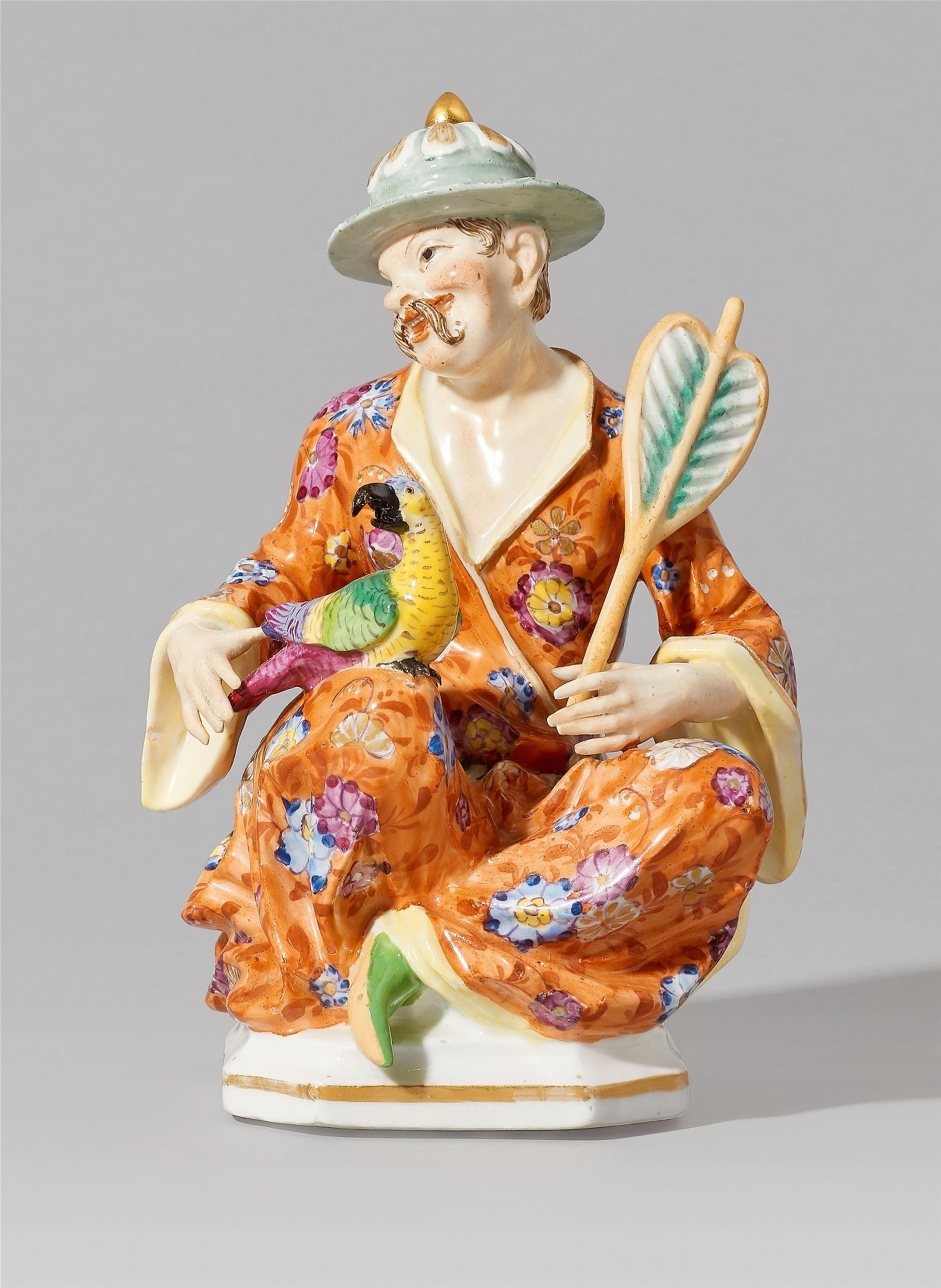 A Meissen porcelain figure of a seated pagode with a parrot - image-1