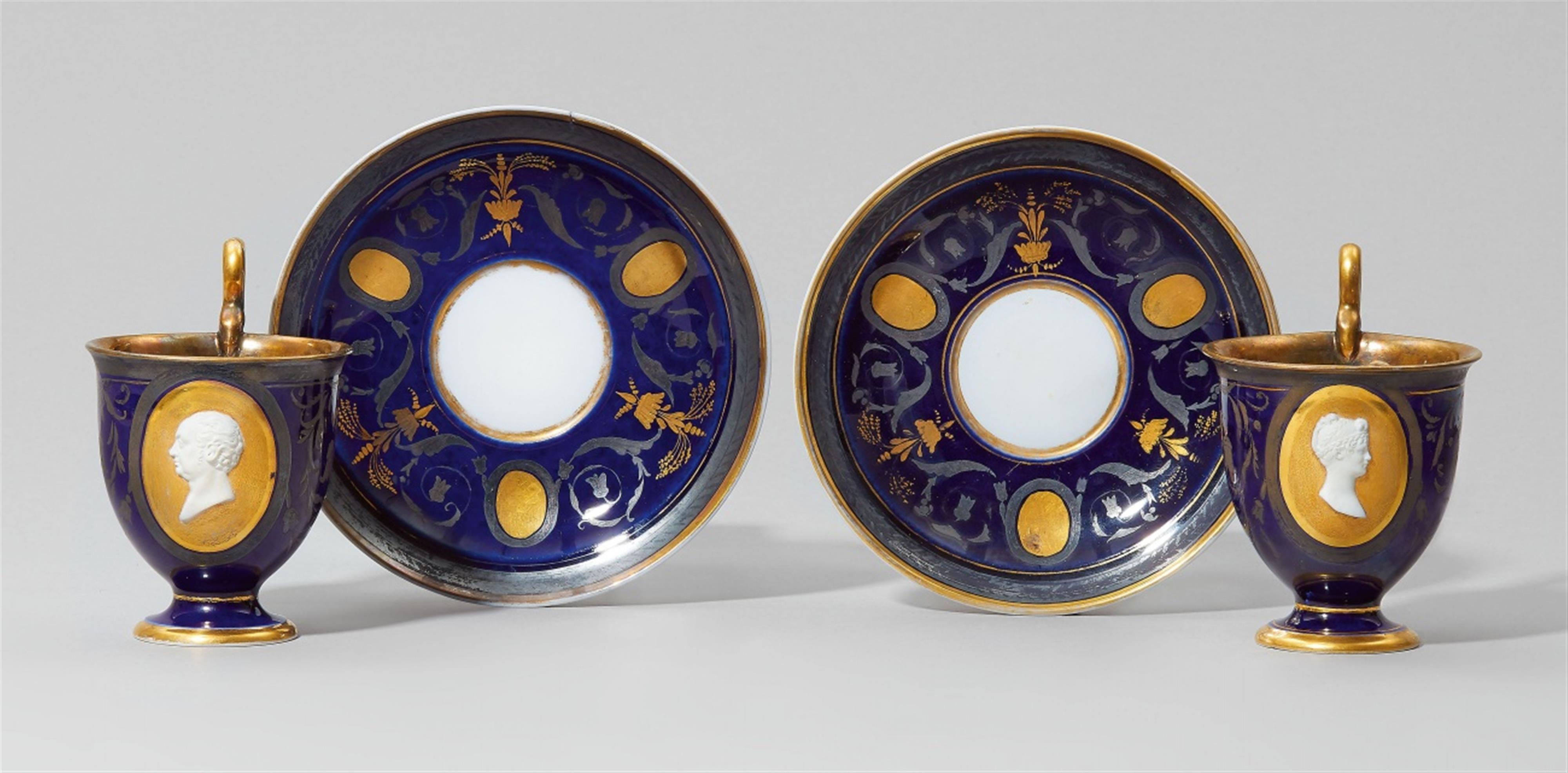 A pair of Nymphenburg porcelain cups with portraits of Max I and Karoline of Bavaria - image-1