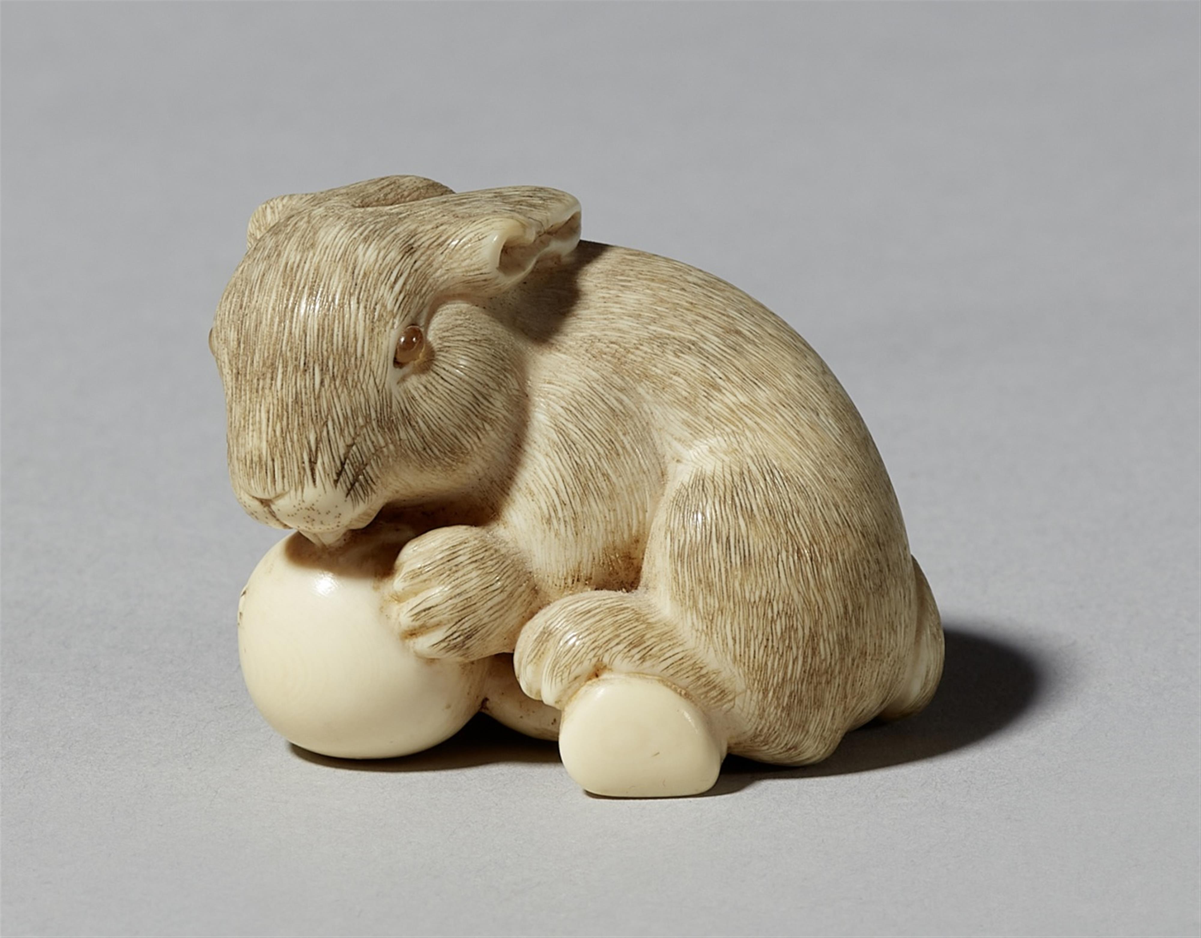 An ivory netsuke of a hare with loquat. Second half 19th century - image-1