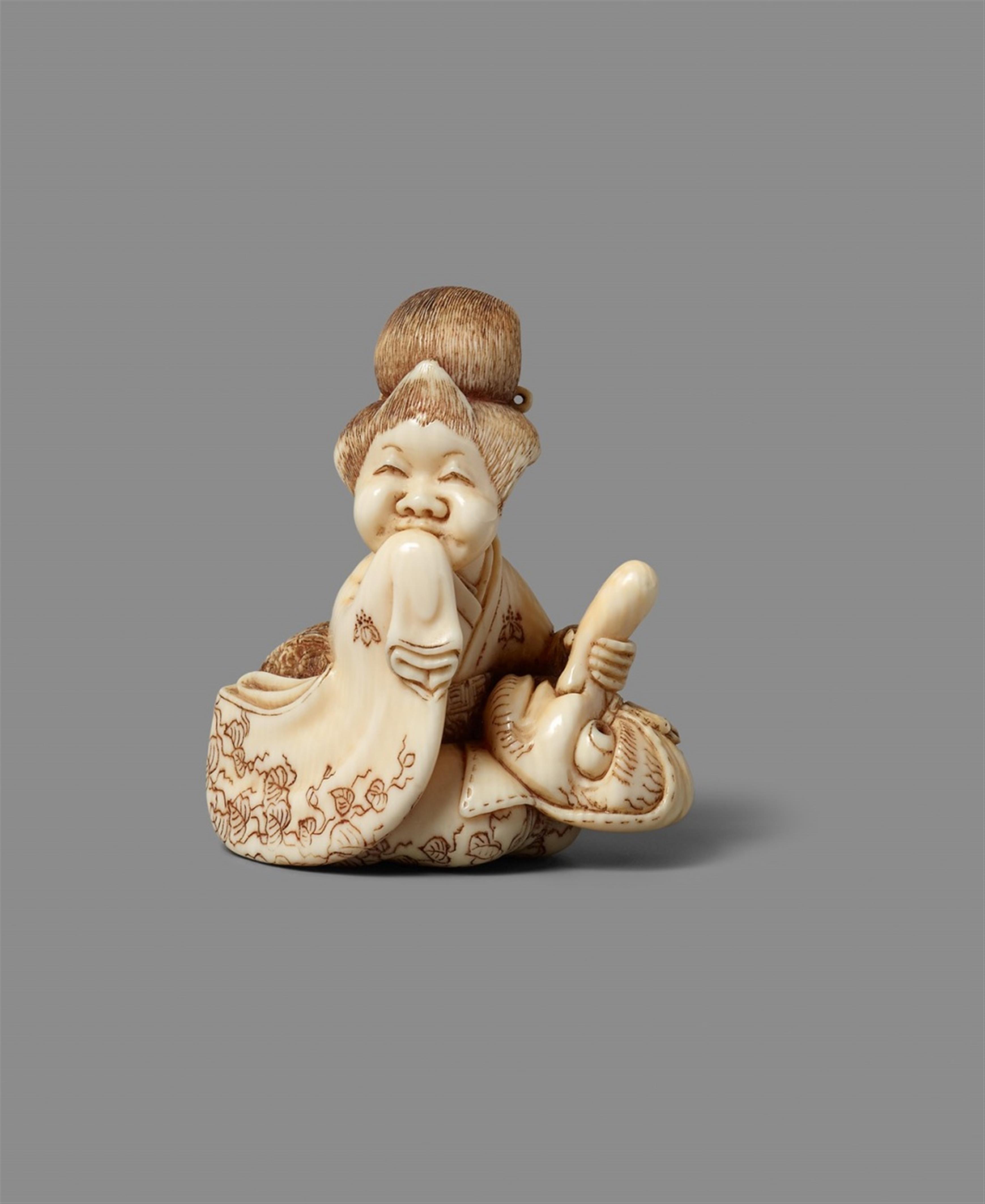 A Tokyo school ivory netsuke of Okame with a mask, by Hidechika. 19th century - image-1