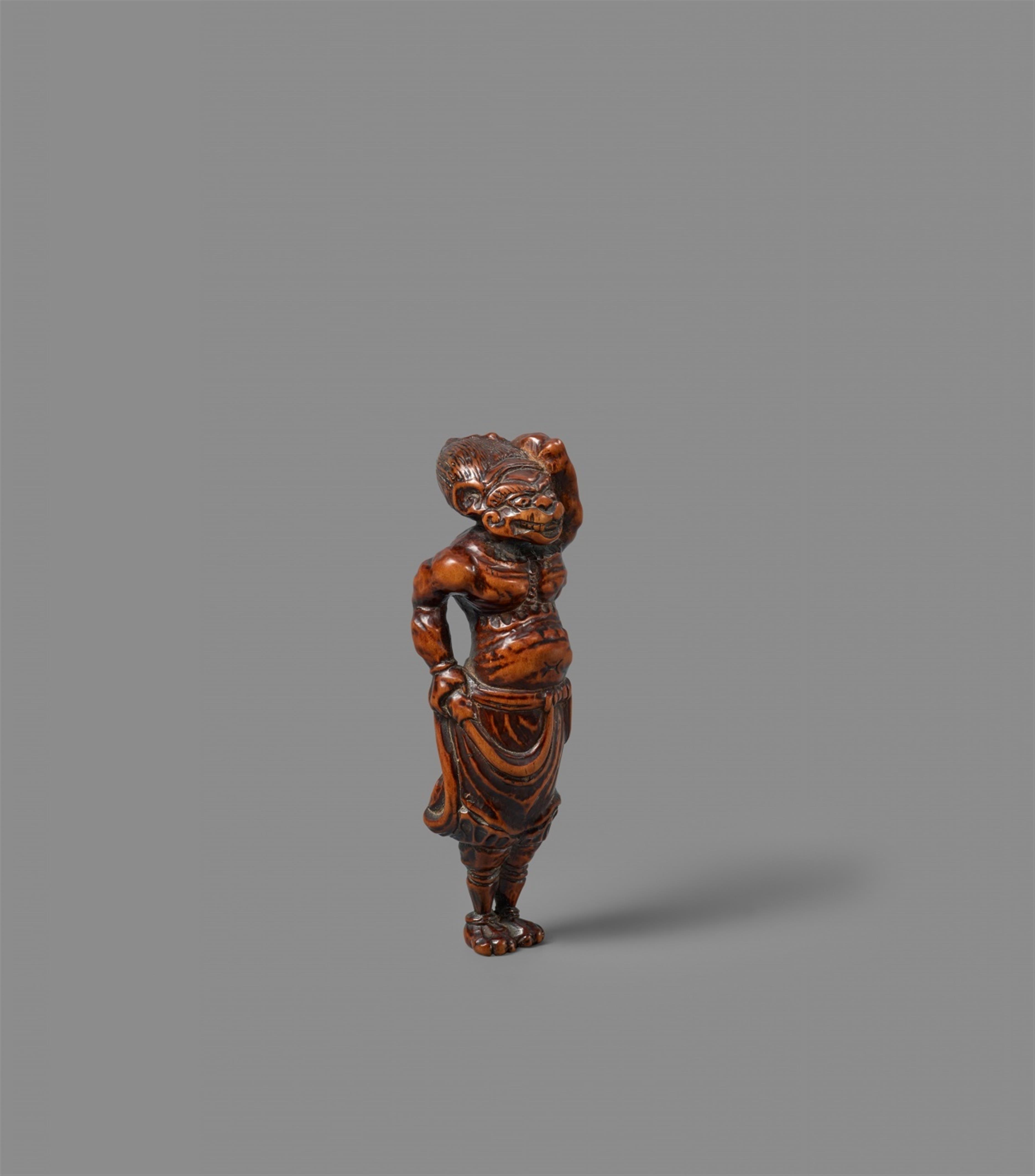 A boxwood netsuke of an oni. Around 1800 - image-1