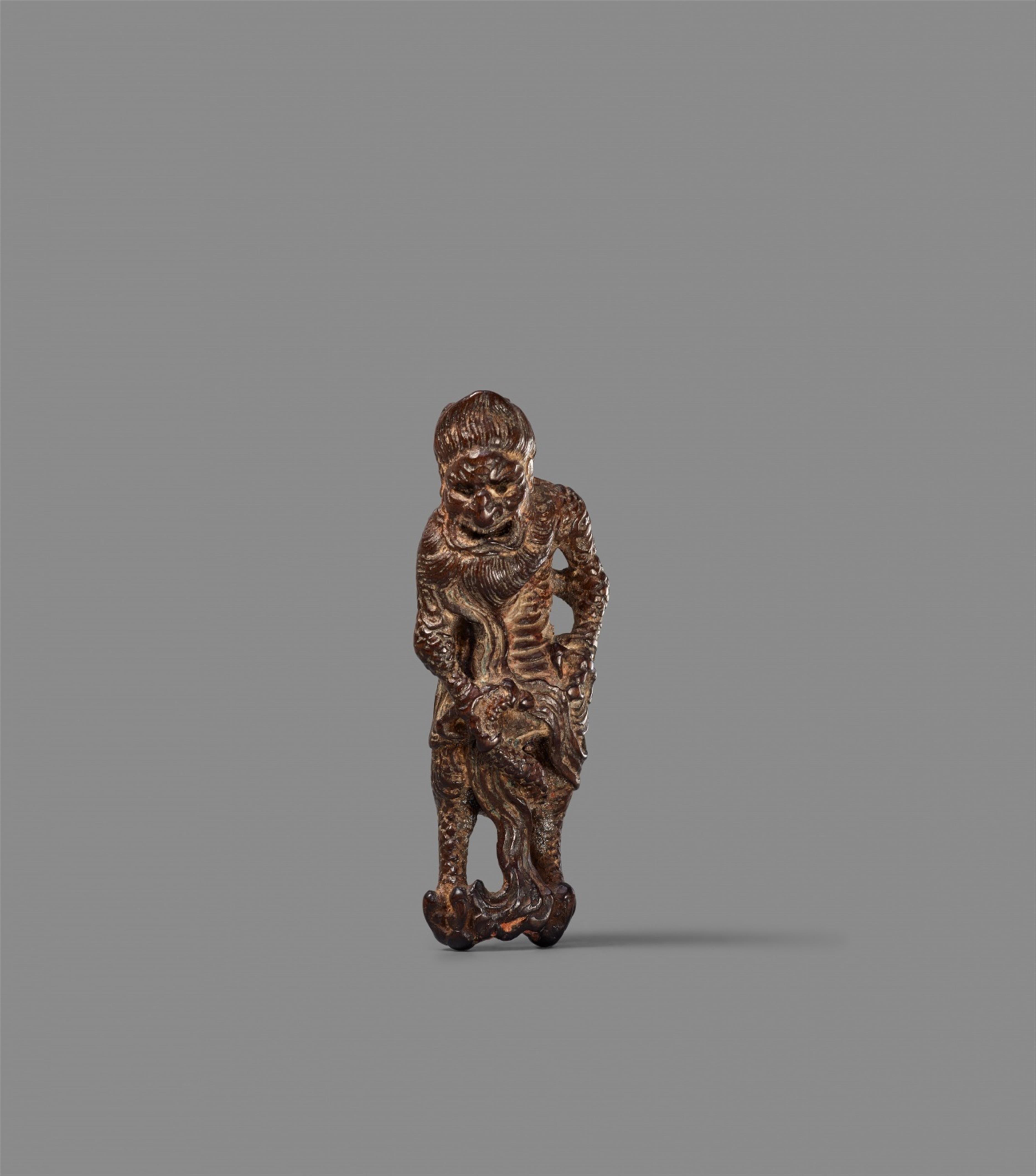 A softwood netsuke of a standing kirin. Possibly 19th century - image-1