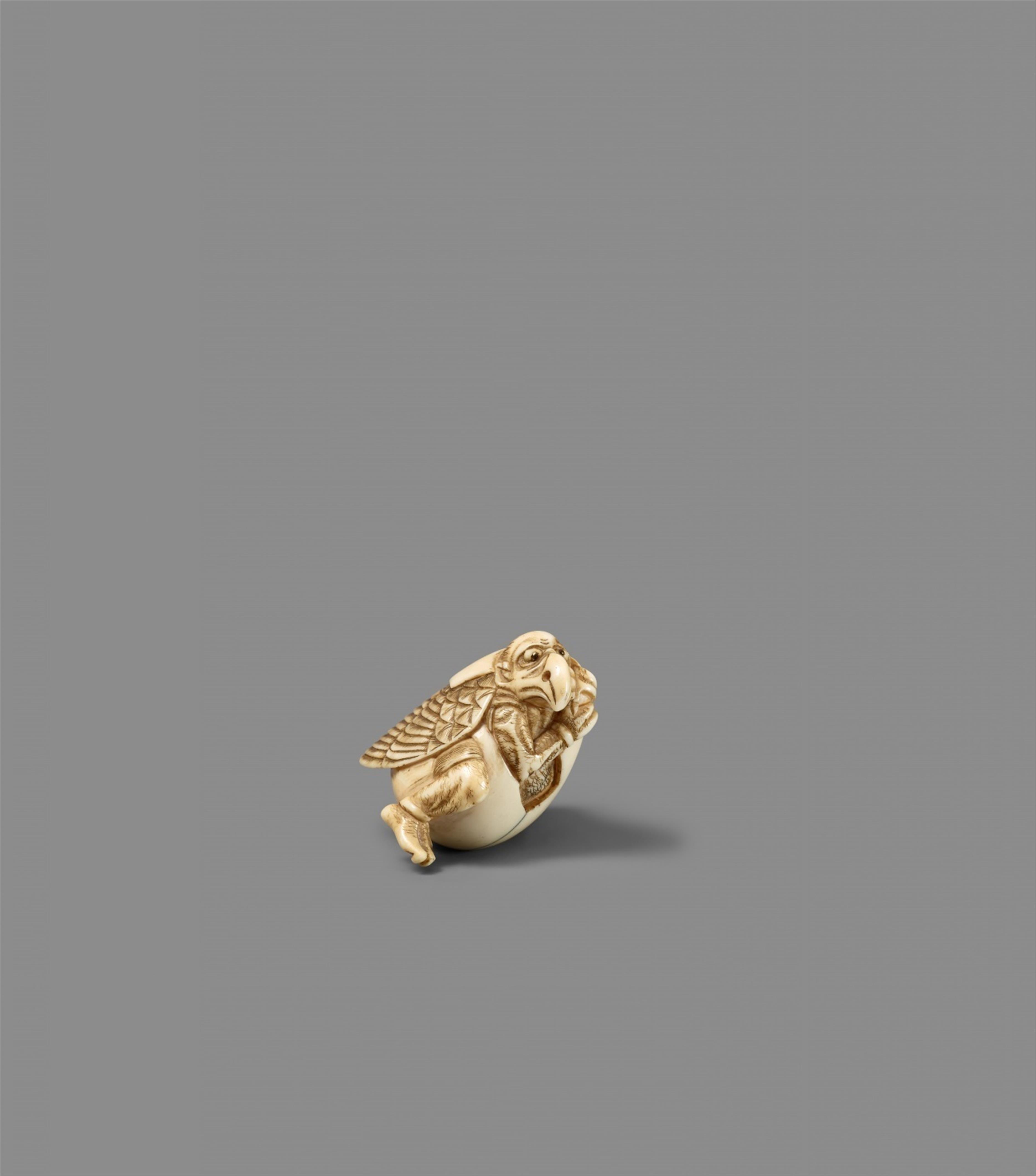An ivory netsuke of a tengu hatching out of its egg. 19th century - image-1