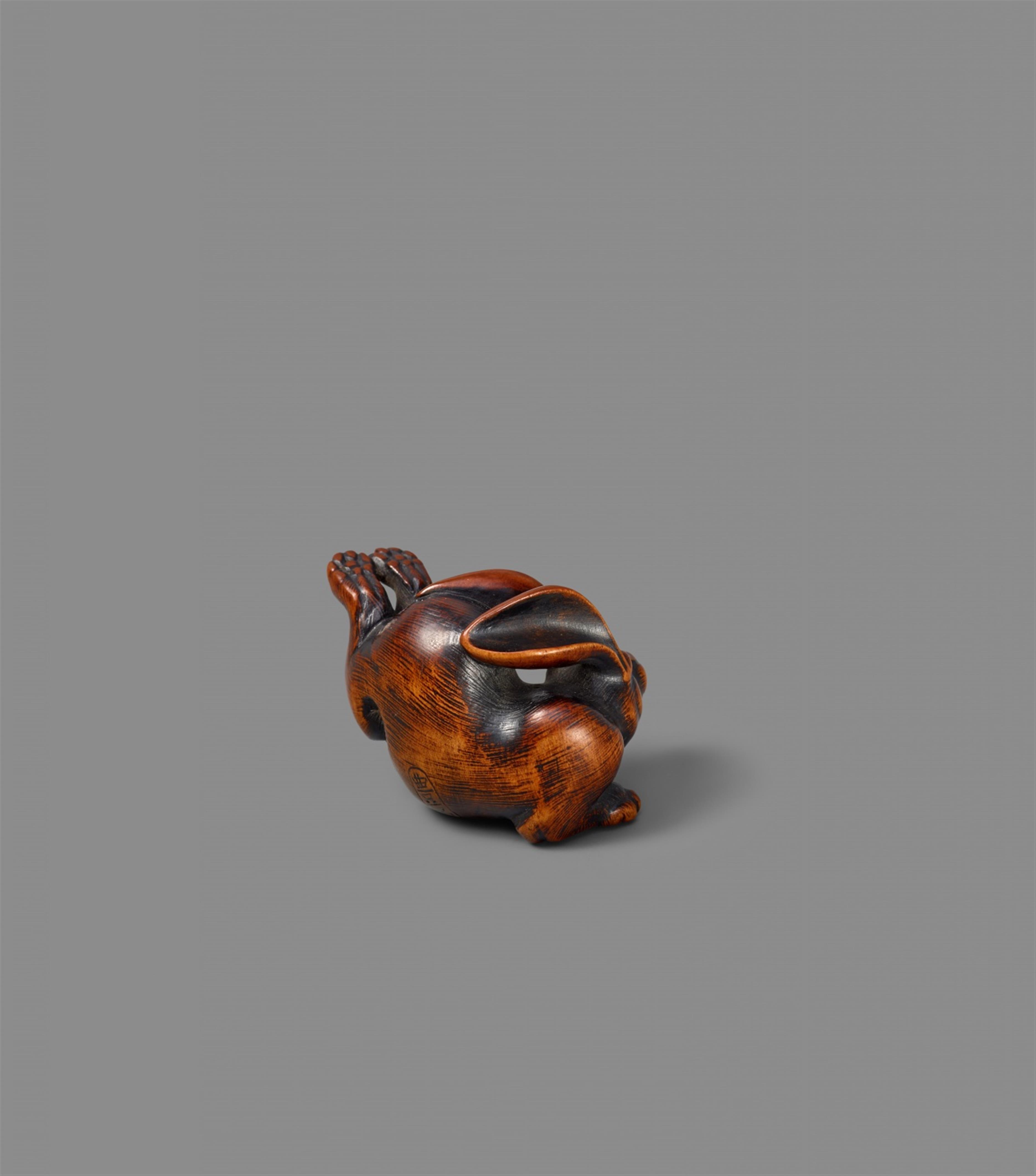 A  boxwood netsuke of a leaping hare. 19th century - image-6