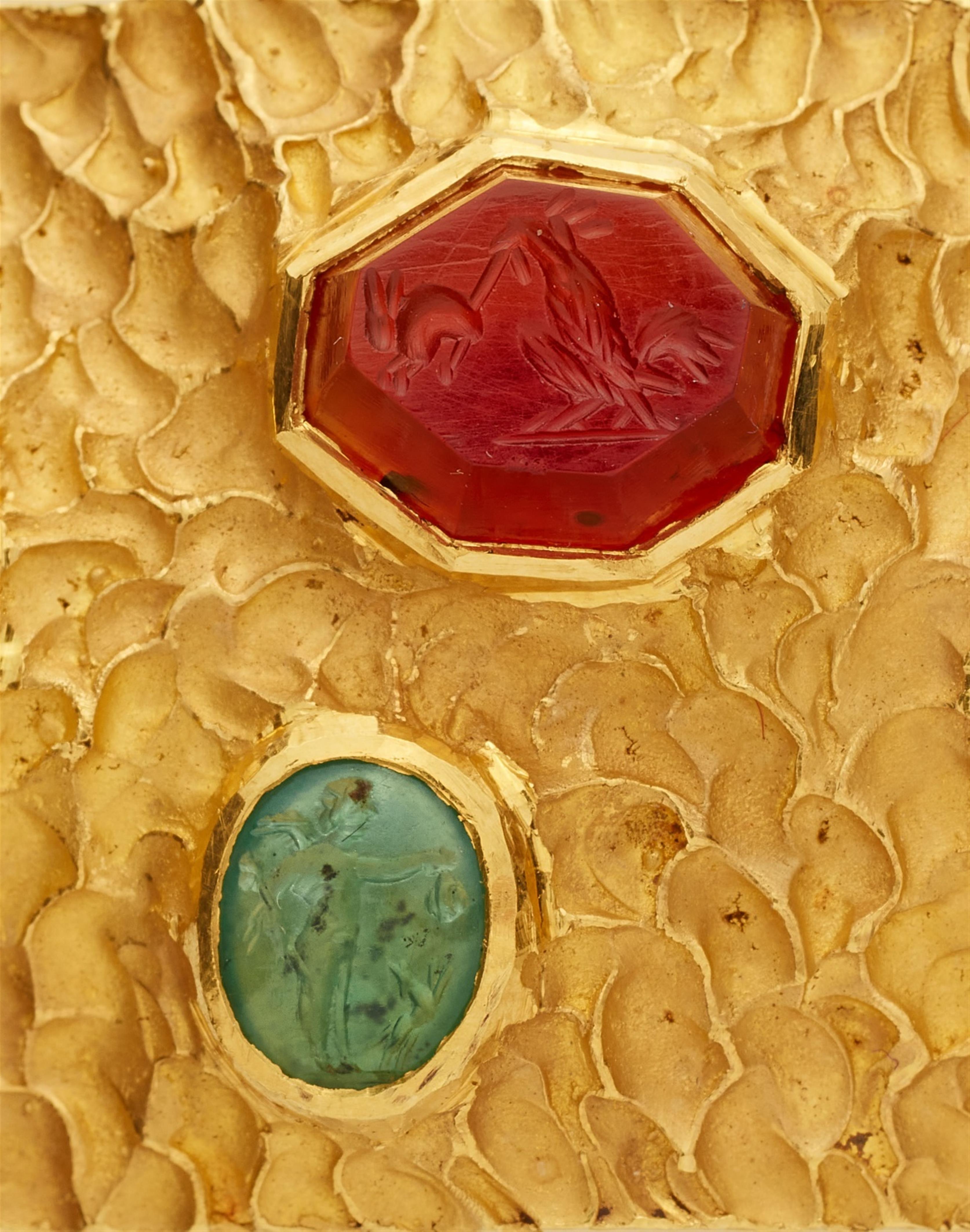 An 18k gold gemstone intaglio bangle - image-4