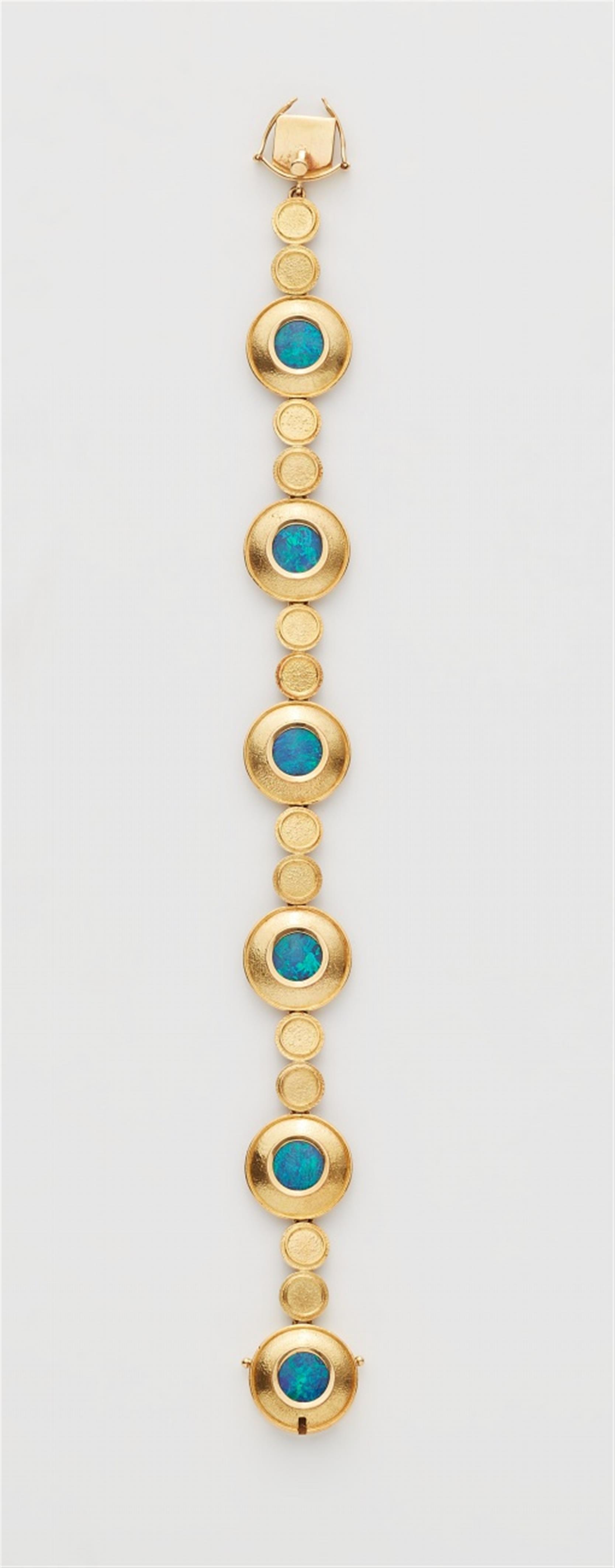 An 18k gold opal bracelet - image-1