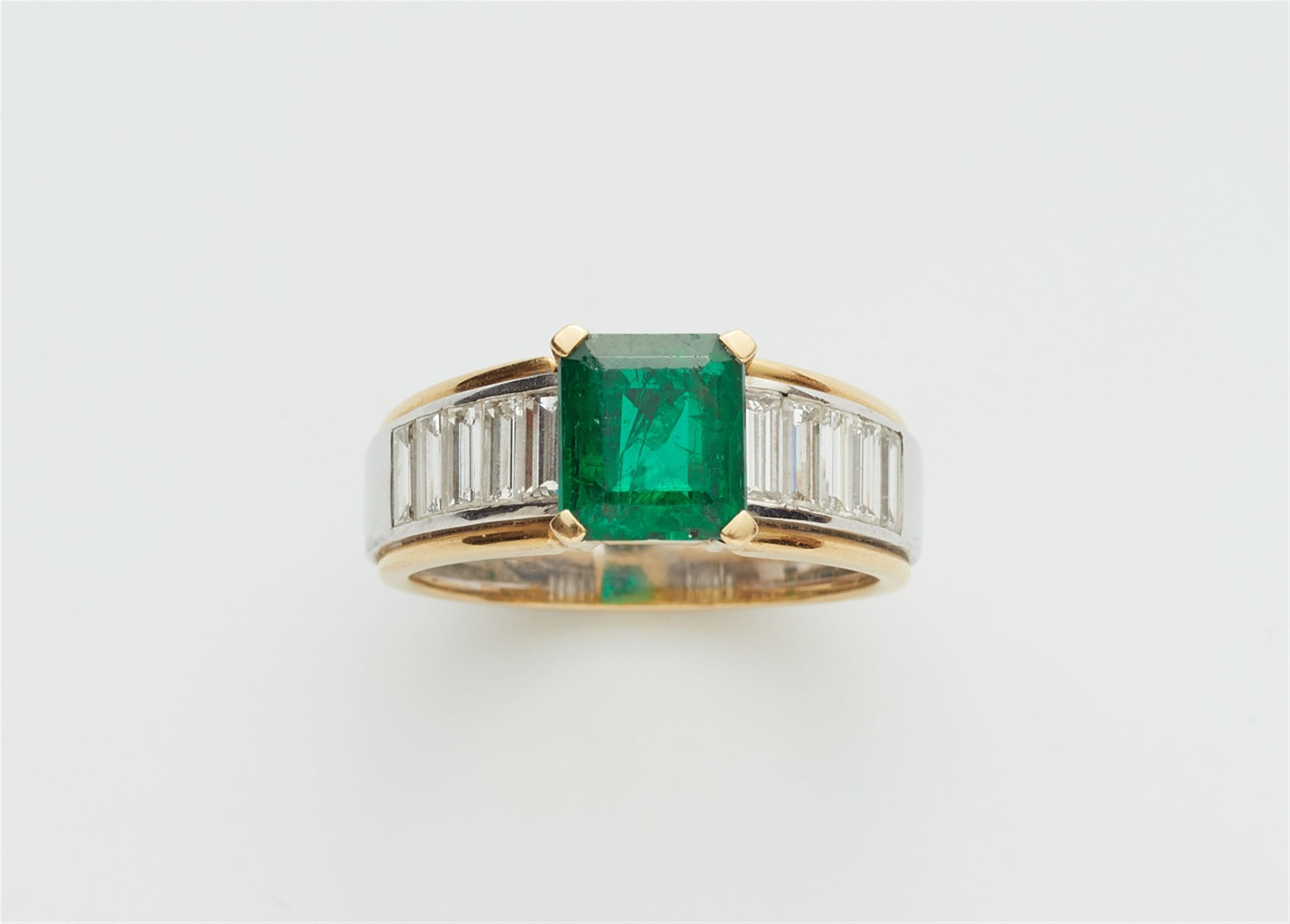 An 18k gold emerald and diamond ring - image-1
