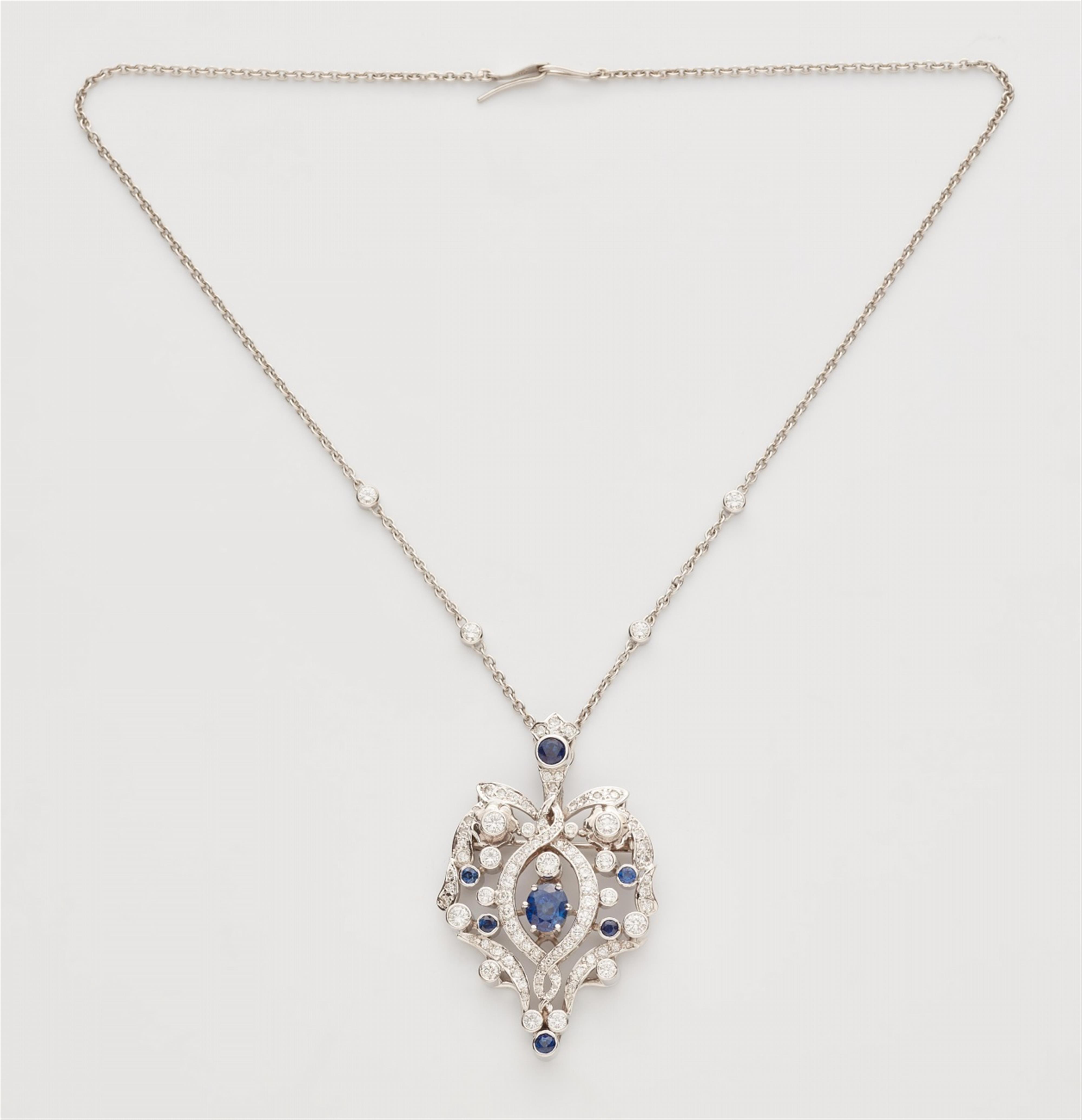 A sapphire and diamond pendant necklace - image-1