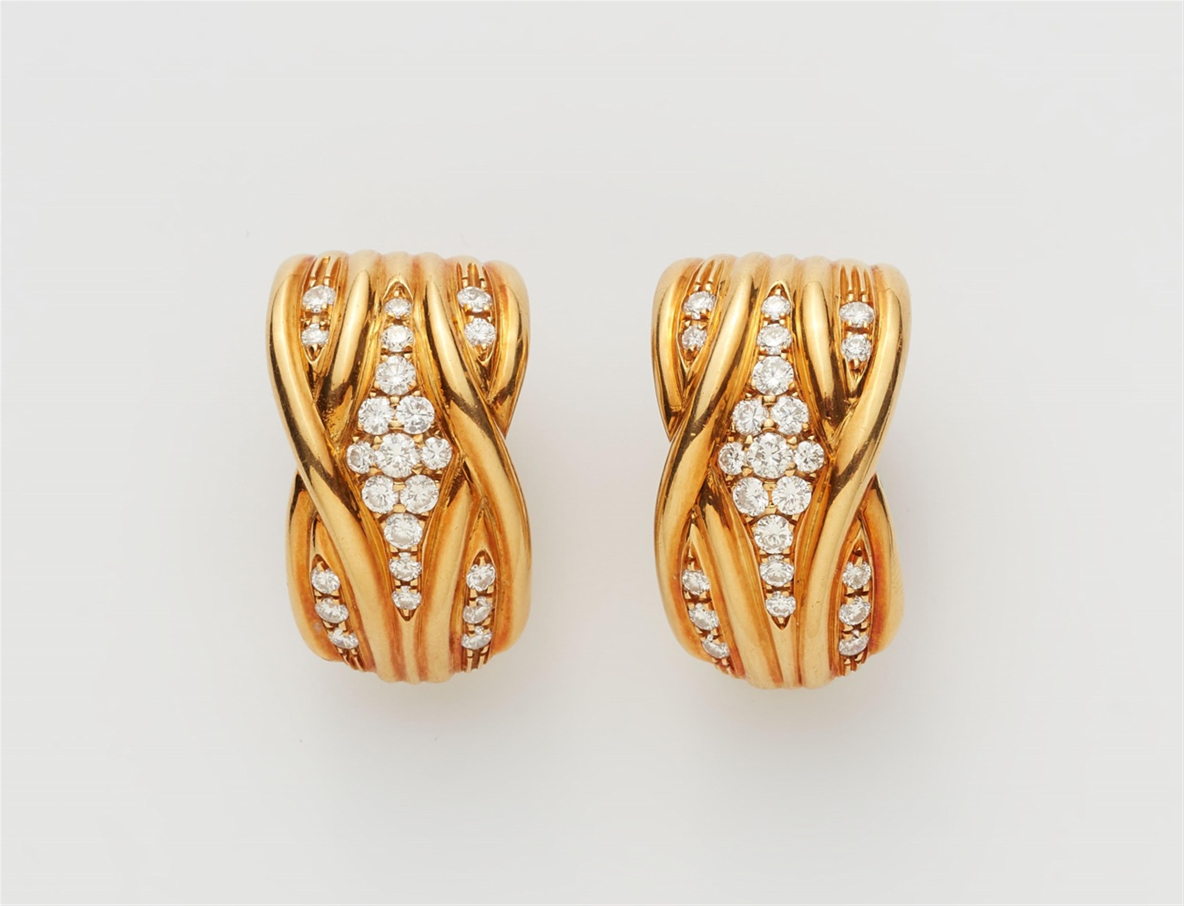 A pair of 18k gold diamond clip earrings - image-1
