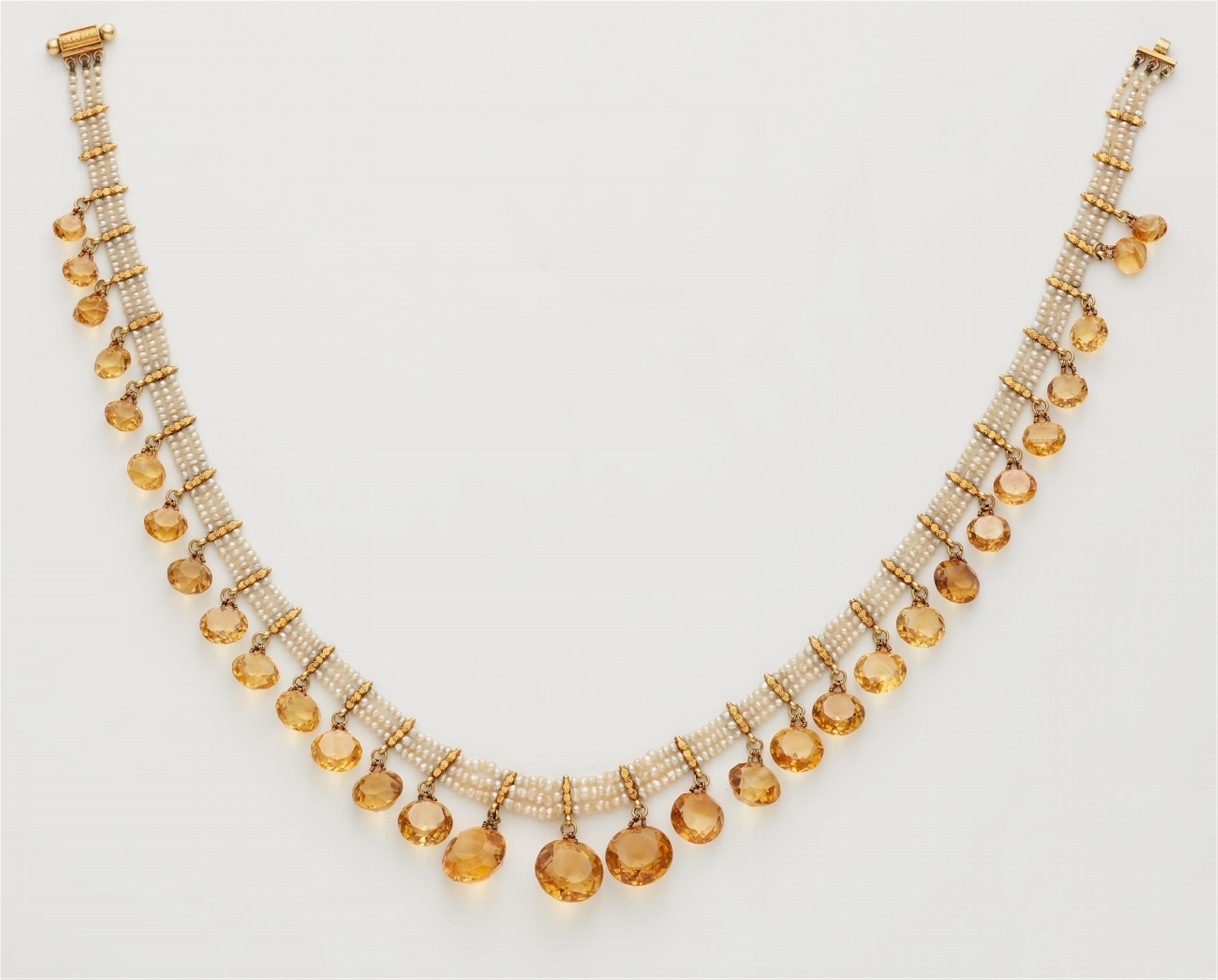 A pearl necklace with citrine pendants - image-1