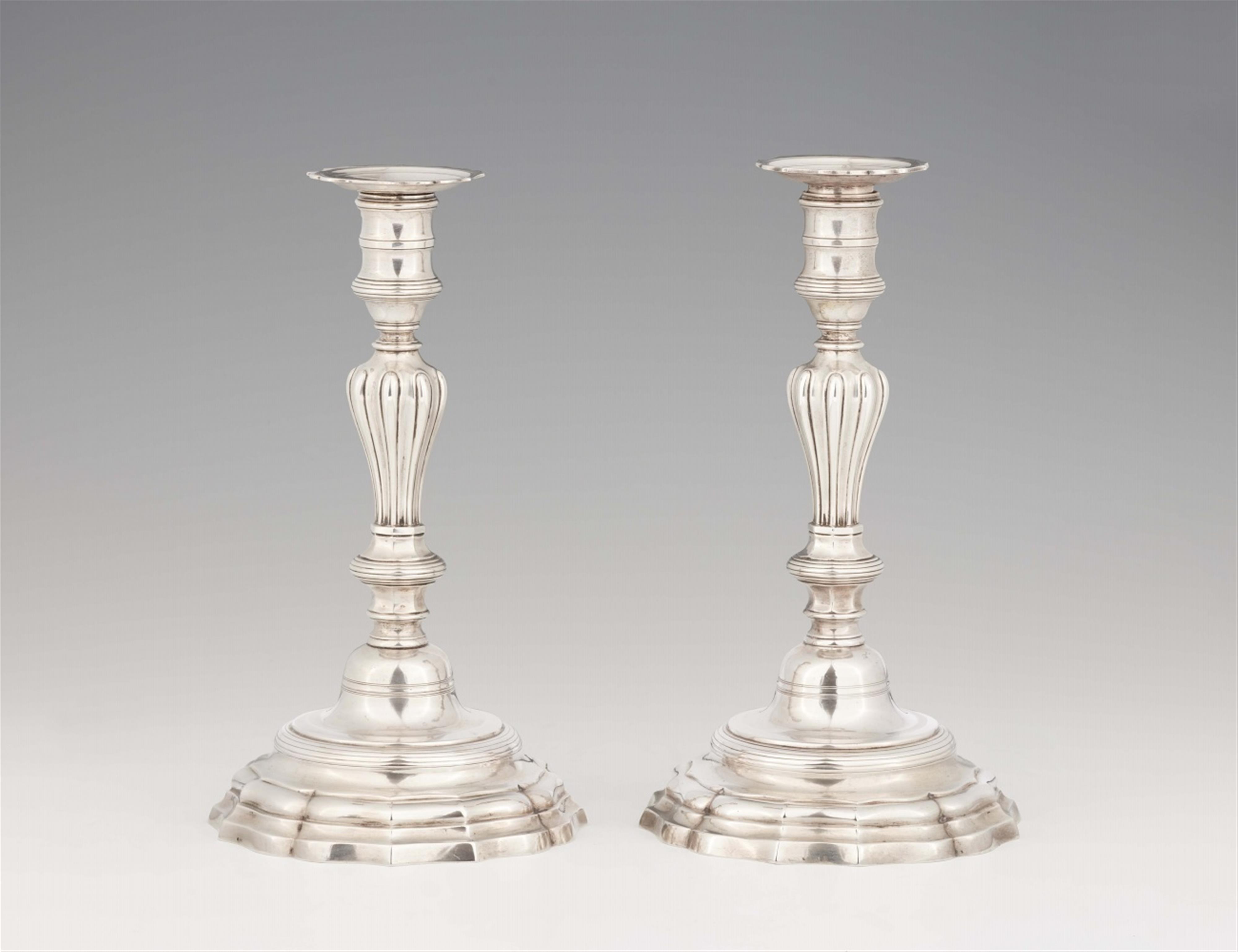 A pair of Strasbourg silver candlesticks - image-1