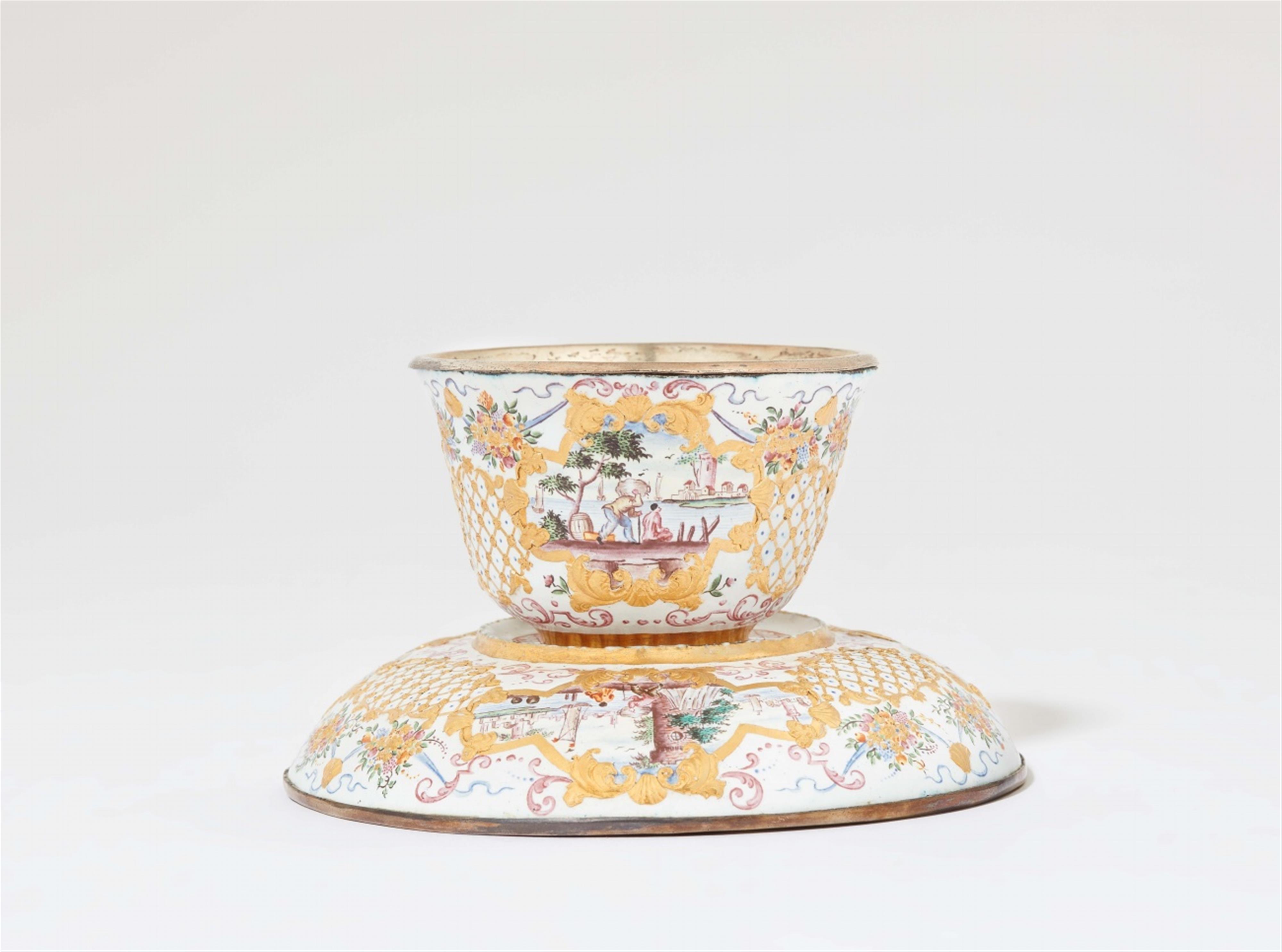 An "émail de Saxe" tea bowl and saucer - image-1