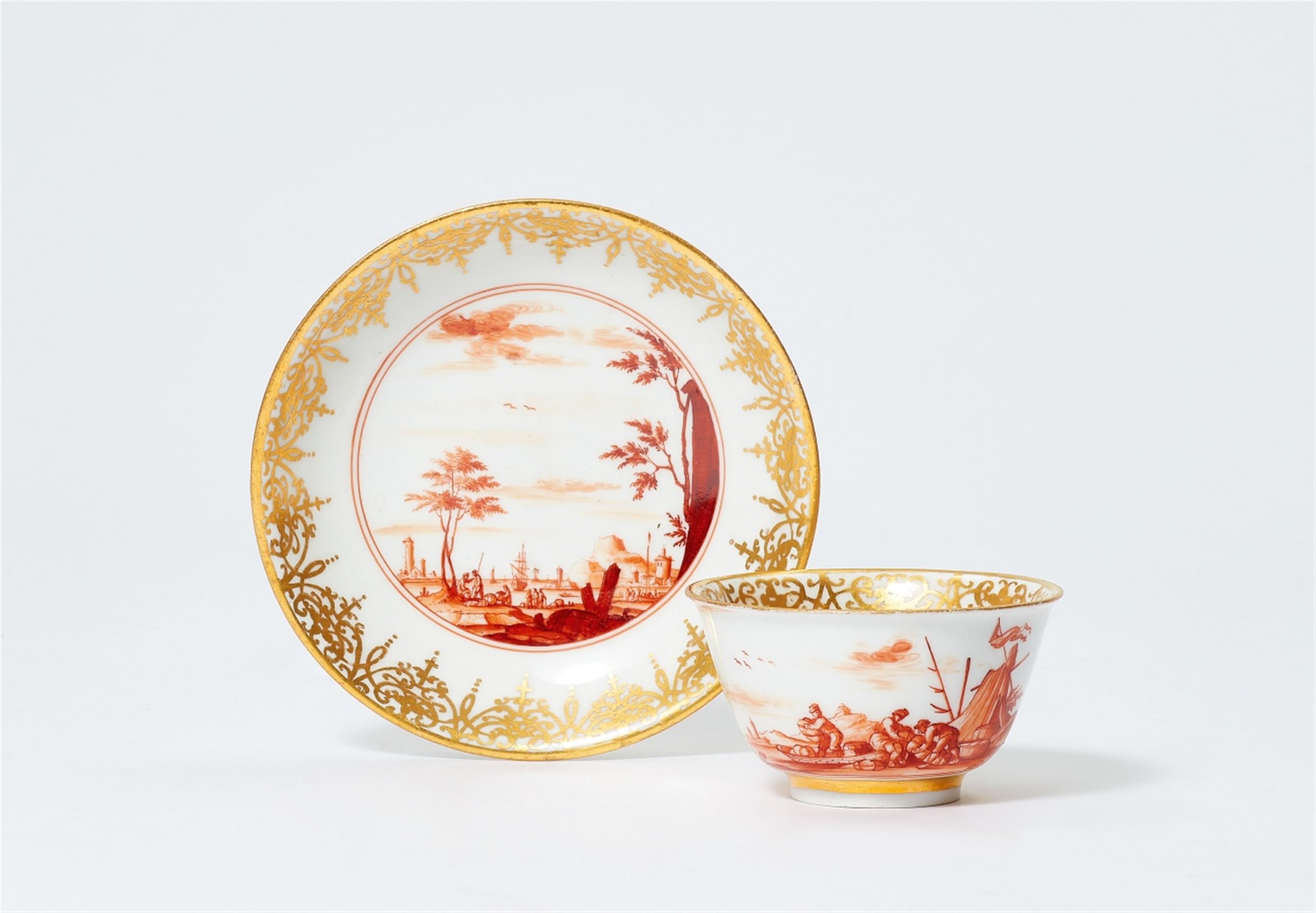 A Meissen tea bowl and saucer with merchant navy scenes in iron red - image-1
