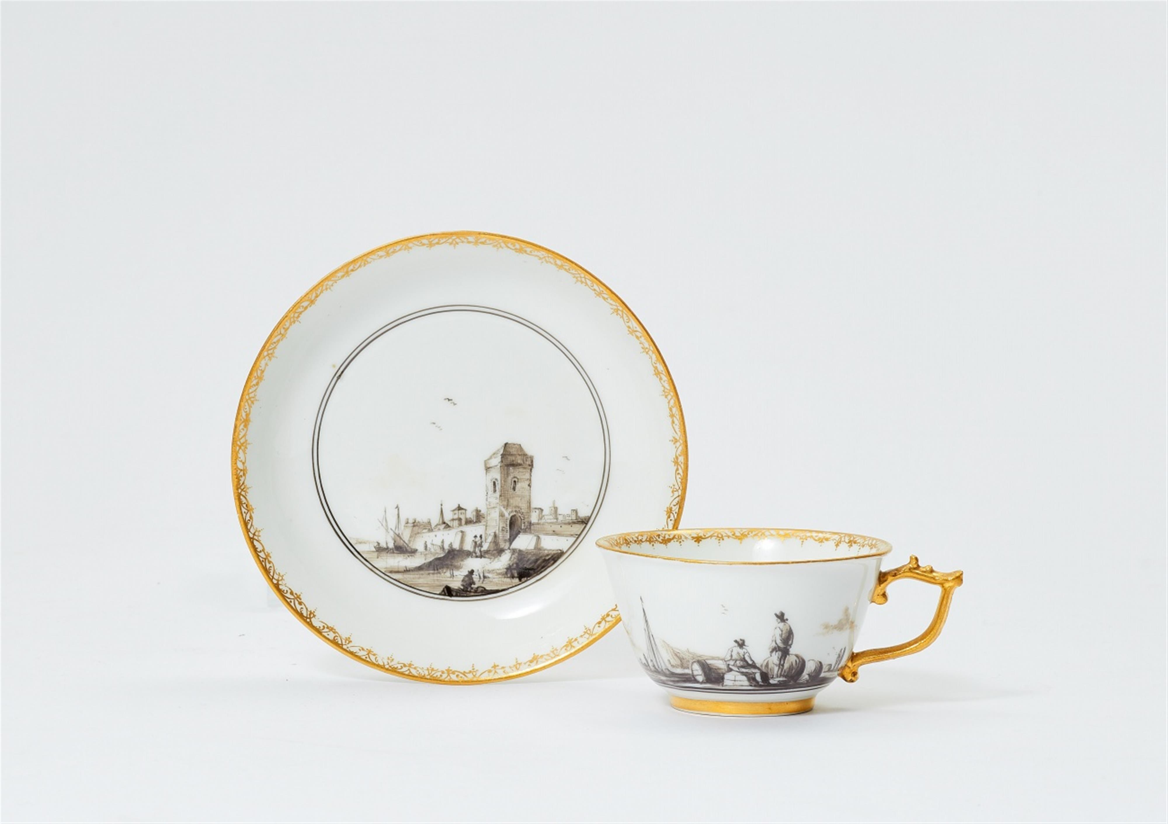 A Meissen porcelain cup and saucer with merchant navy scenes in black camaieu - image-1