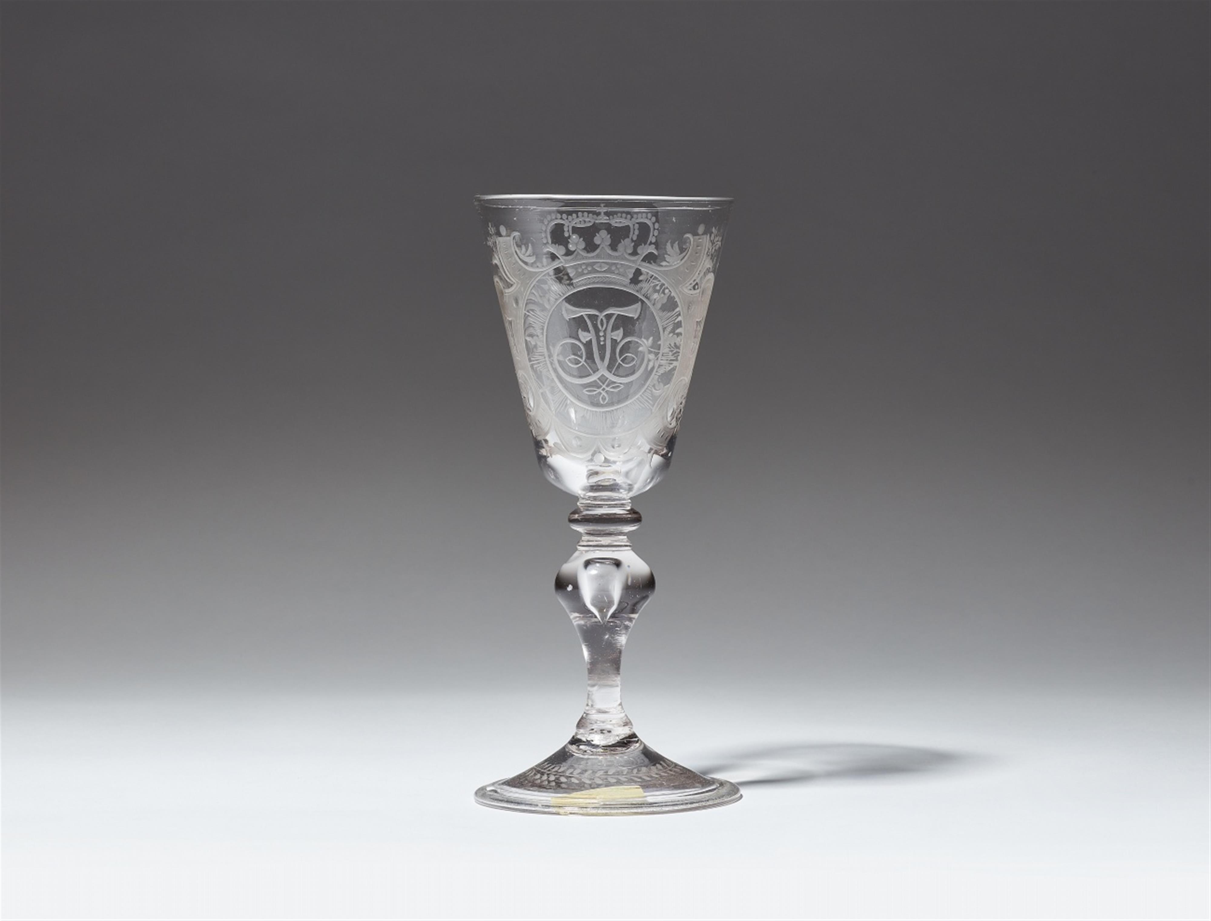 A Saxon cut and wheel engraved glass goblet with a mirrored letter F - image-1
