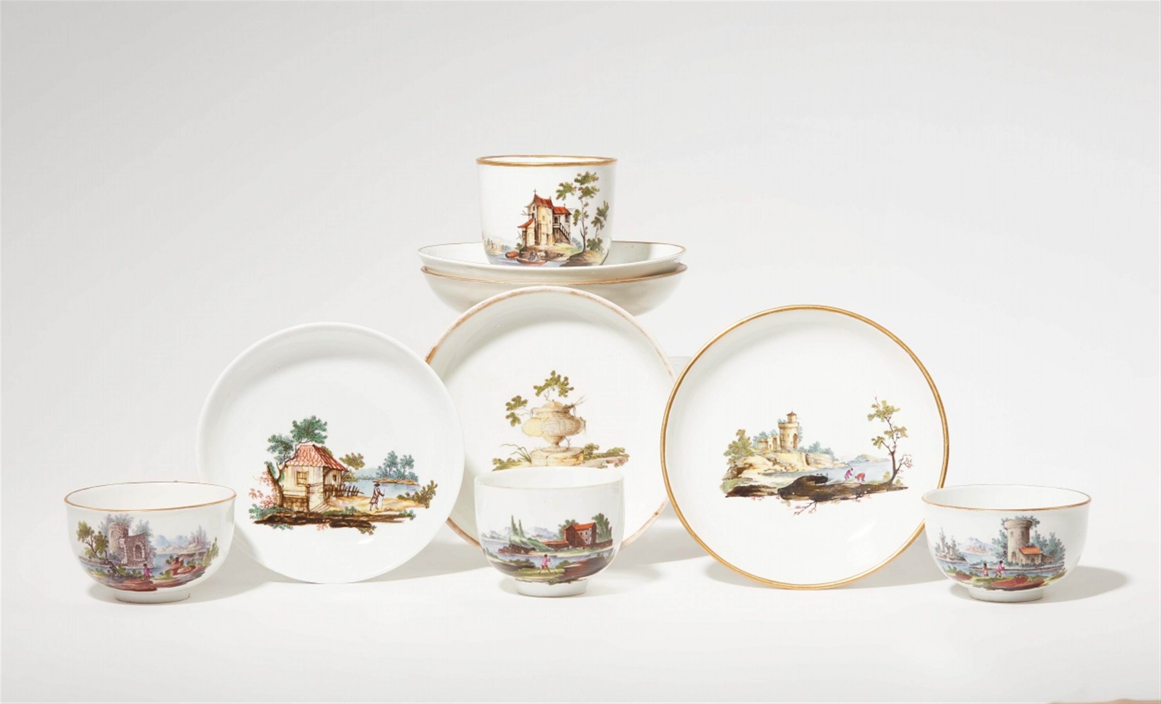 Four Fulda porcelain cups and five saucers with landscape decor - image-1
