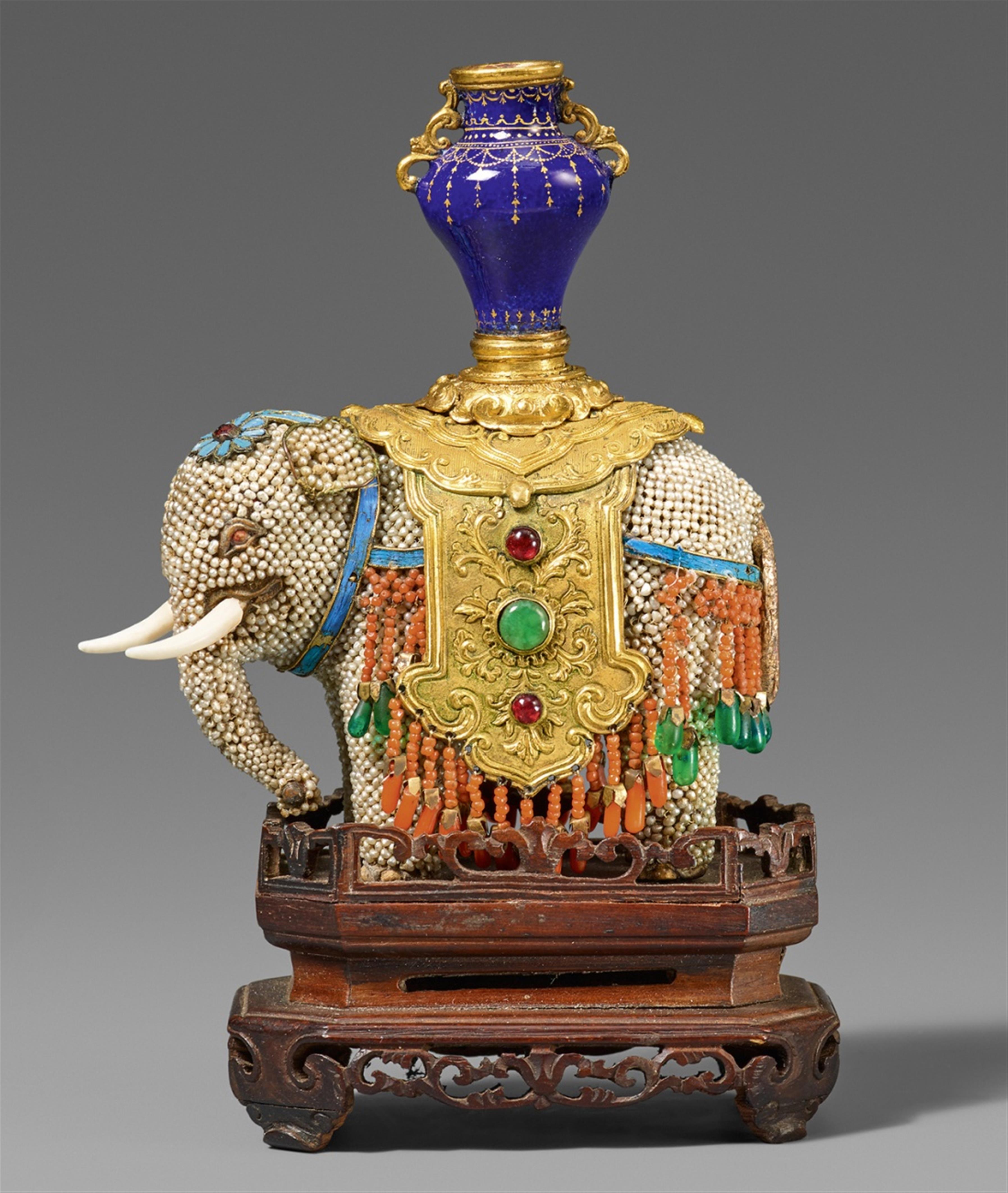 A jewelled gilt bronze model of an elephant with trappings in mixed media. 18th century - image-1