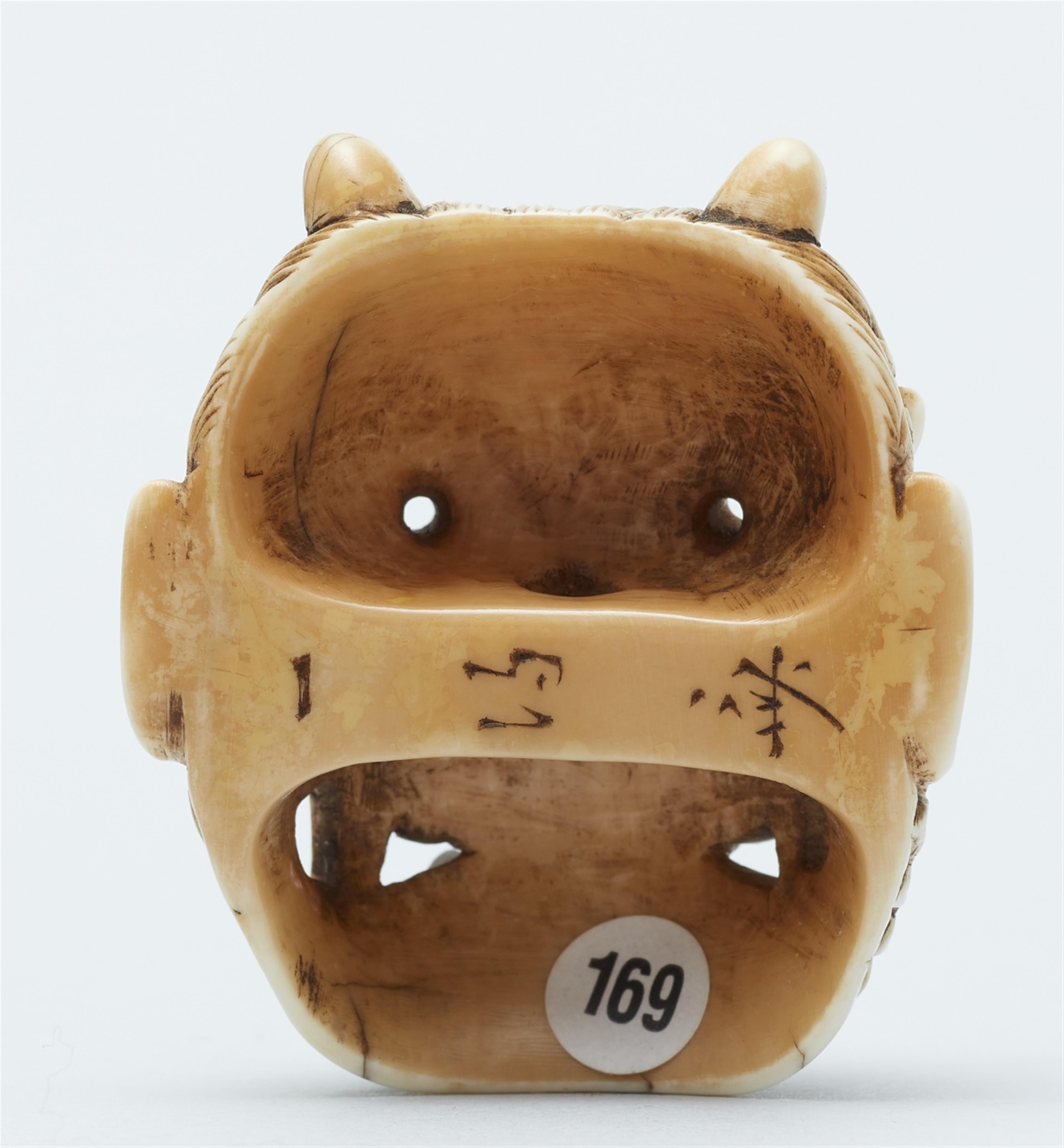 An ivory netsuke of an oni mask. Second half 19th century - image-2