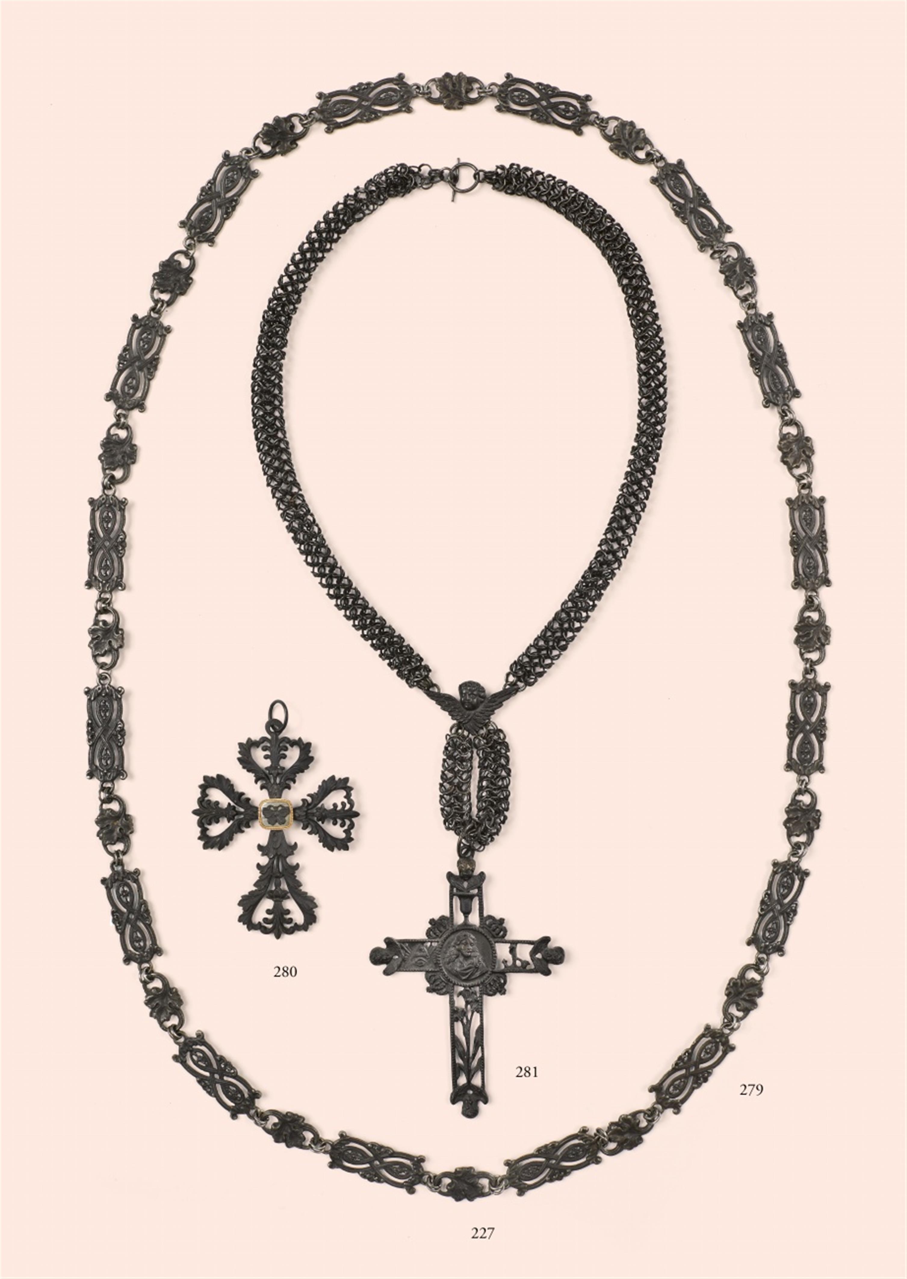 A cast iron cross pendant - image-1