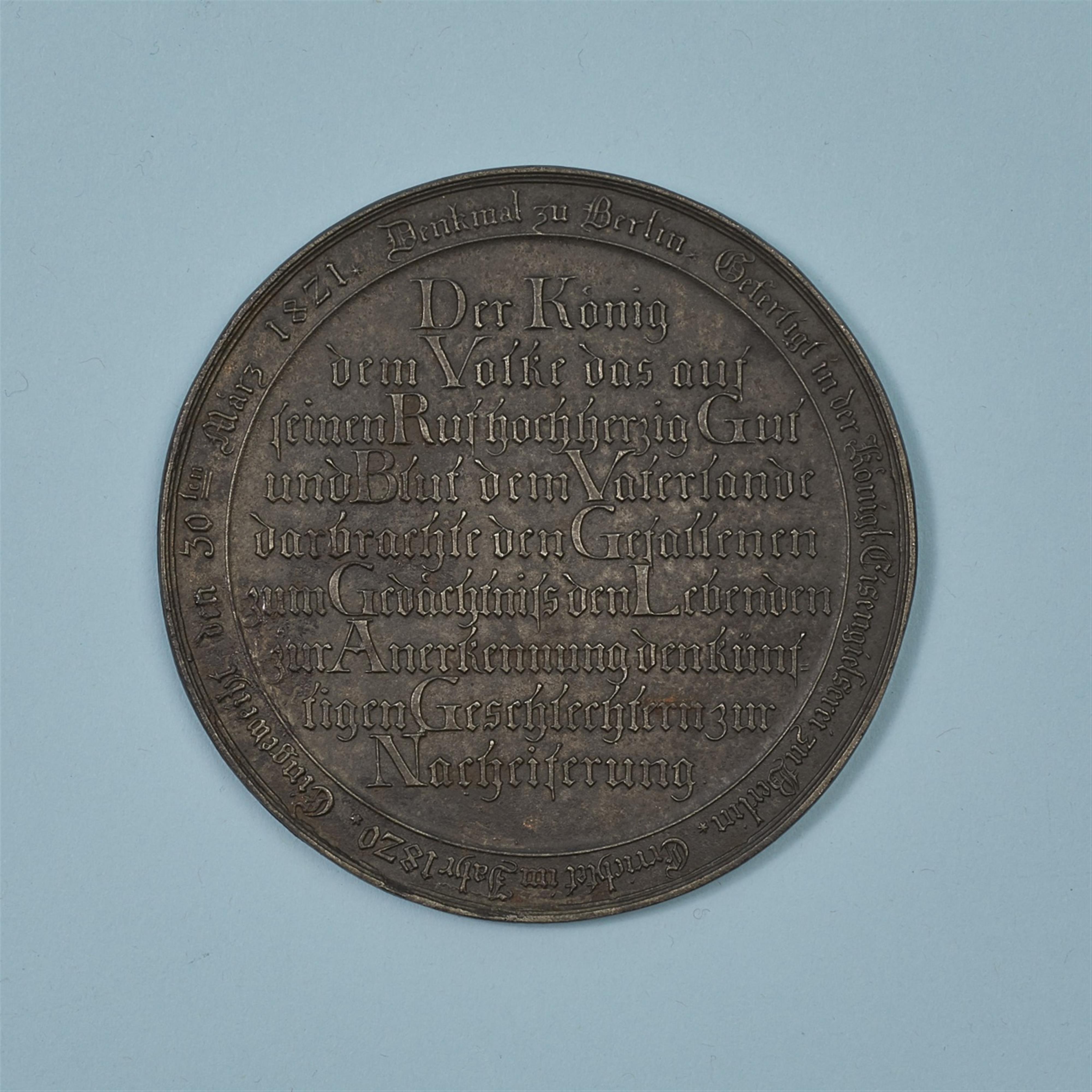 A cast iron medallion with the Kreuzberg Monument - image-2