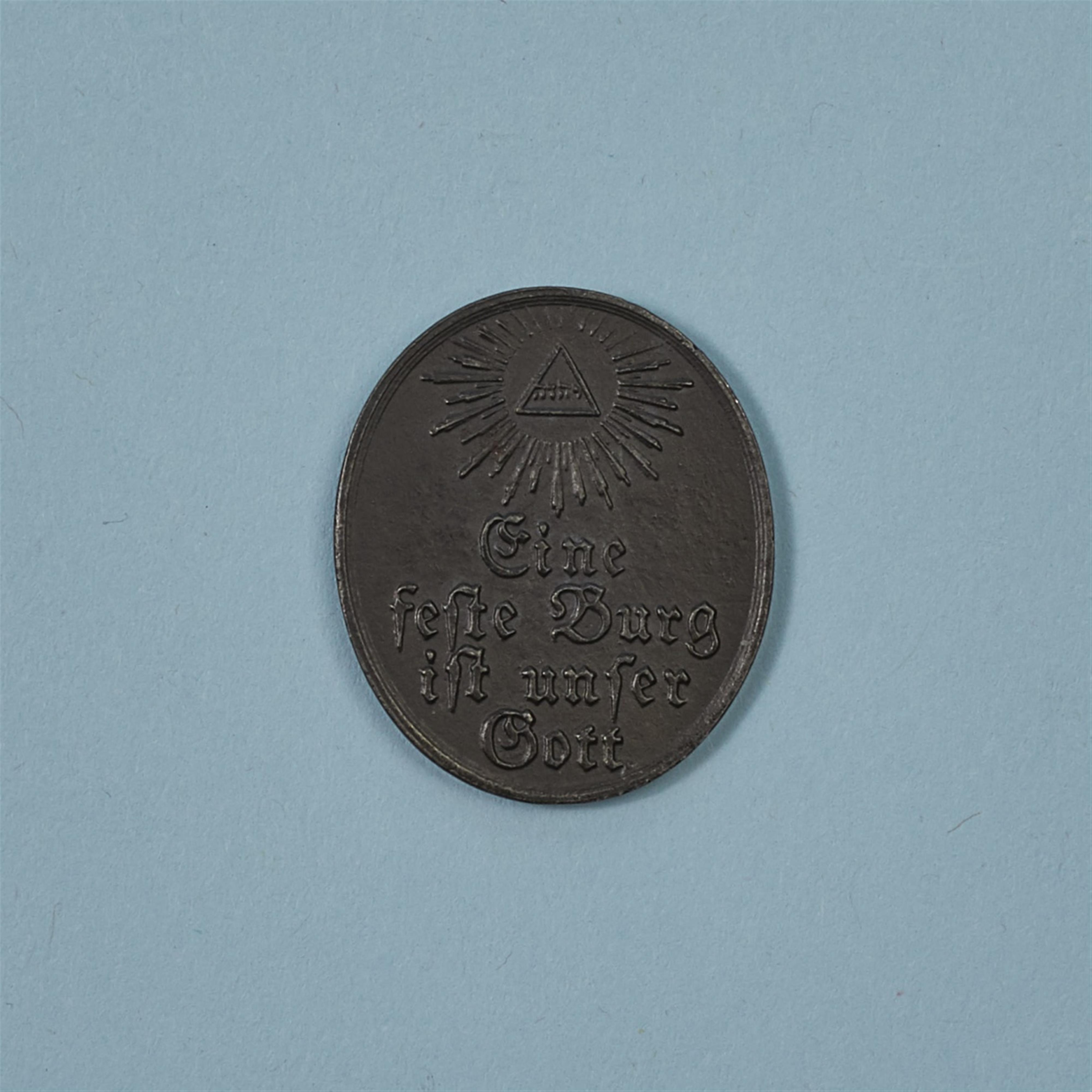 A cast iron medallion inscribed “Eine feste Burg ist unser Gott” - image-2