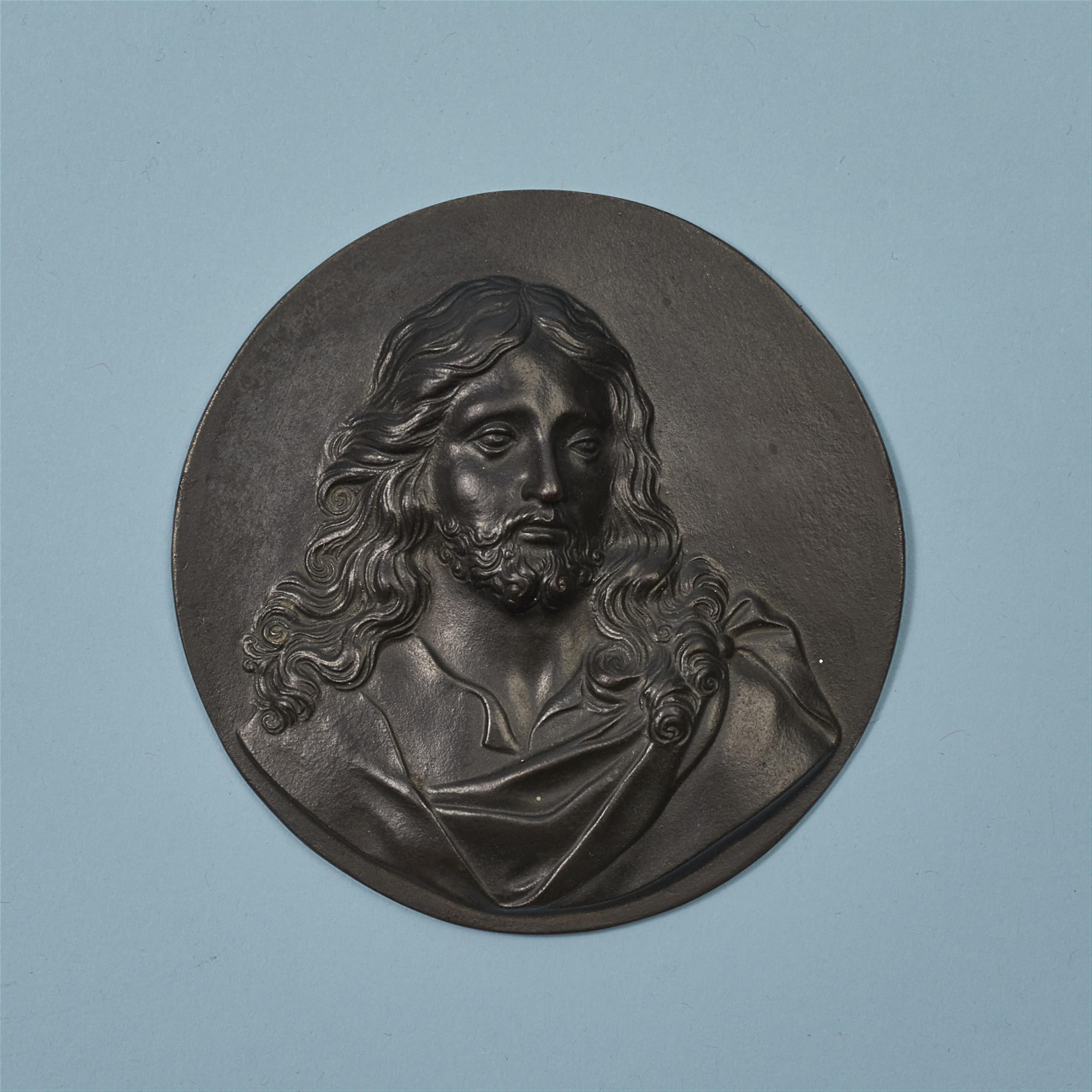 A cast iron plaque with a depiction of Christ - image-1