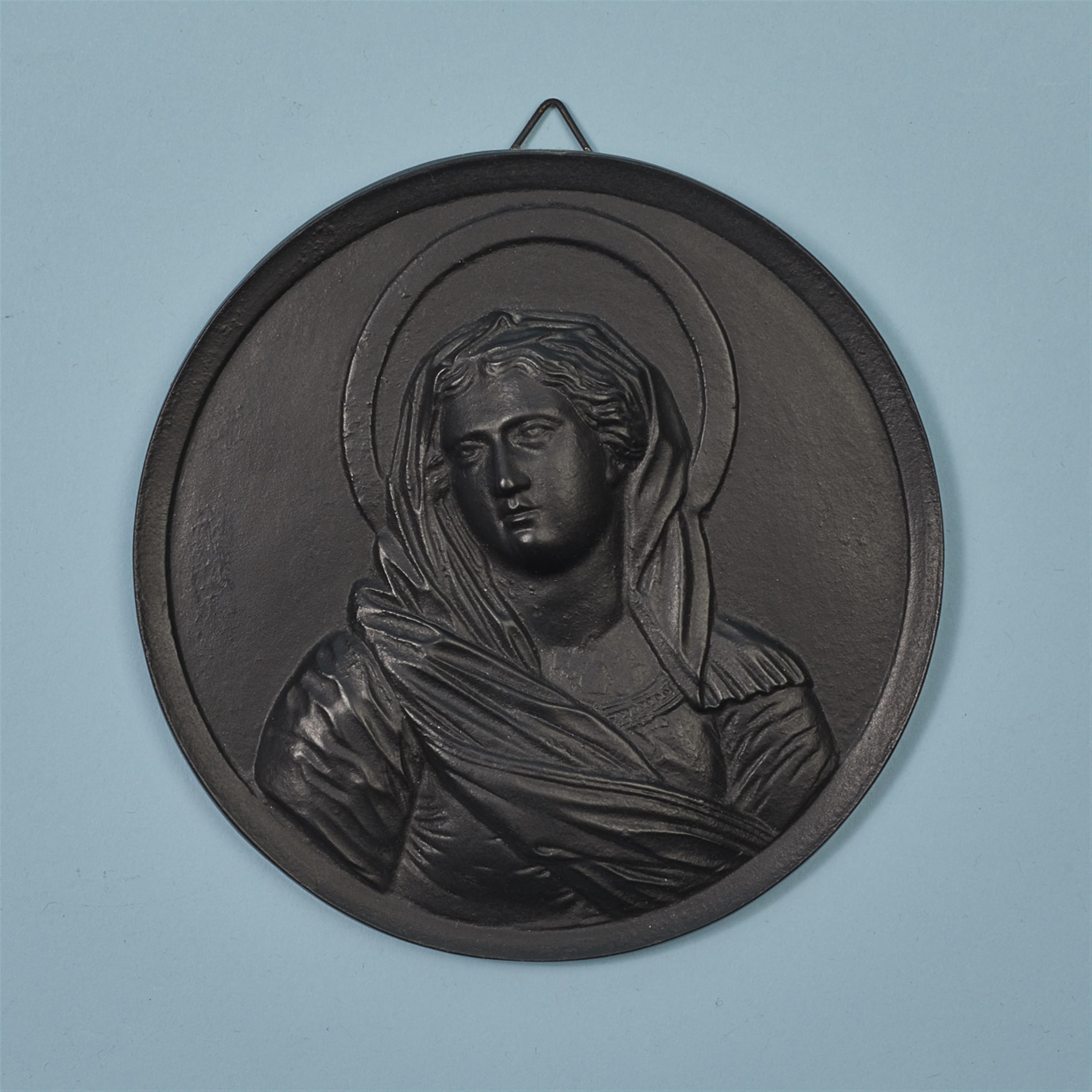 A cast iron plaque with the Virgin Mary - image-1