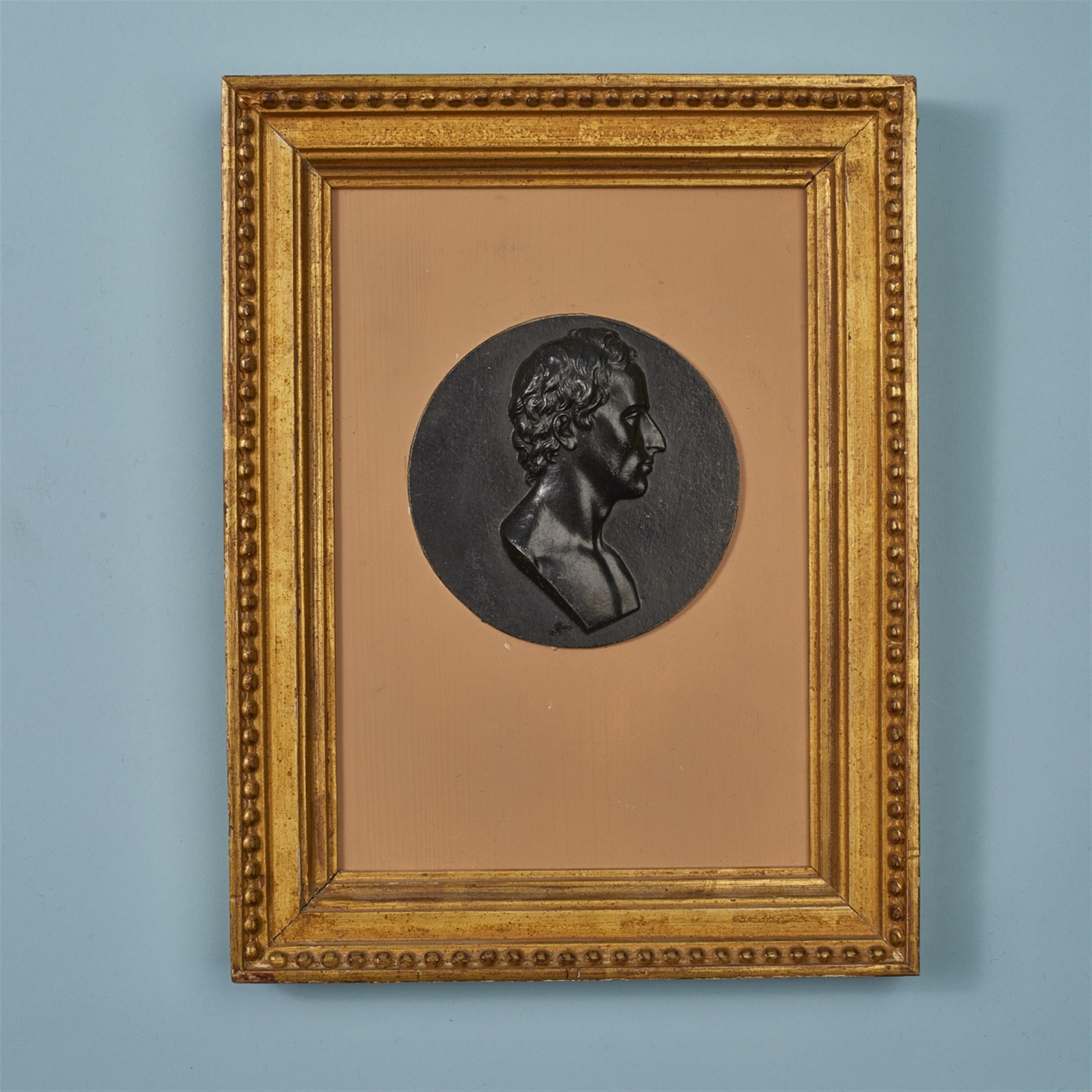A round cast iron plaque with a portrait of Friedrich von Schiller - image-1