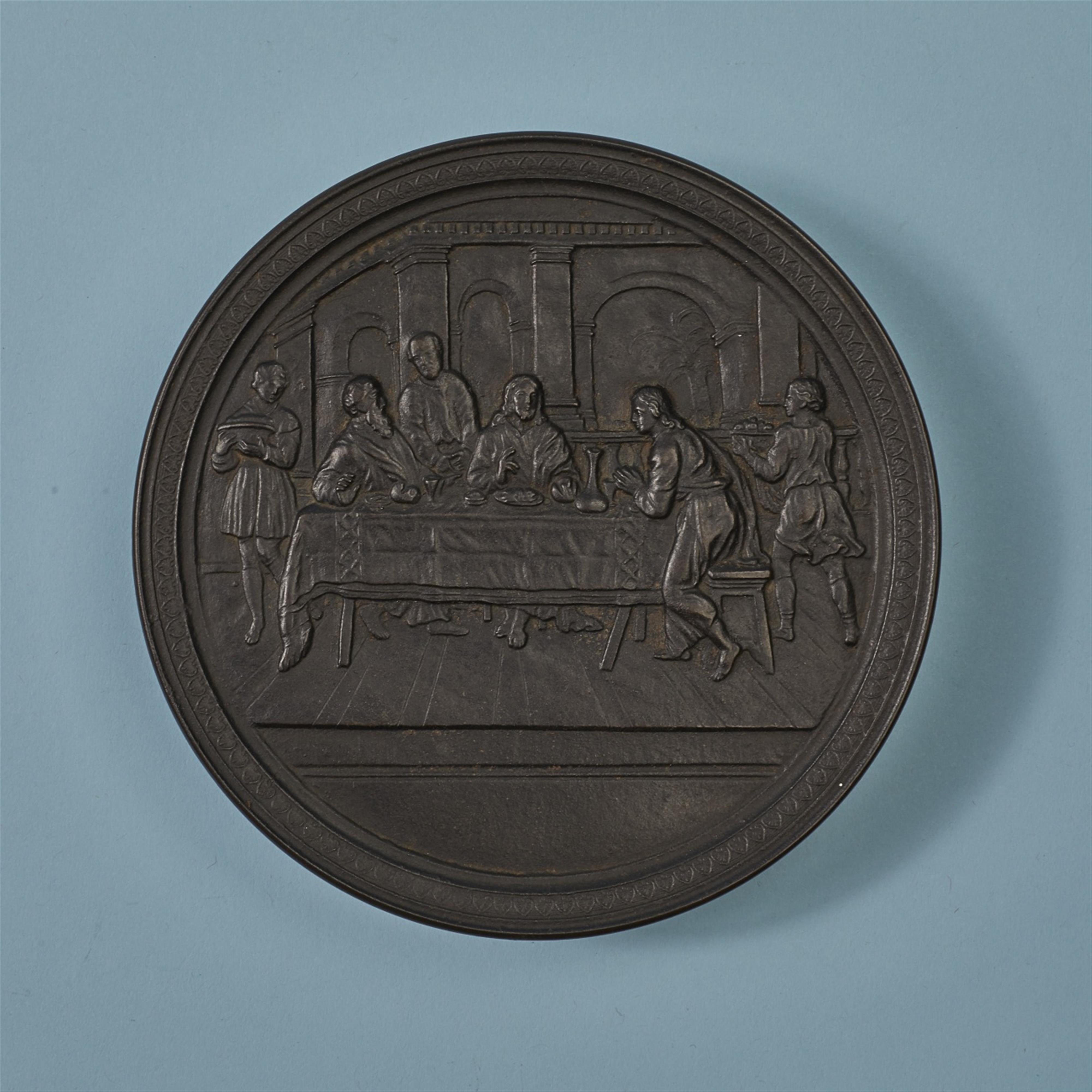 A large round cast iron box with the Supper at Emmaus - image-1