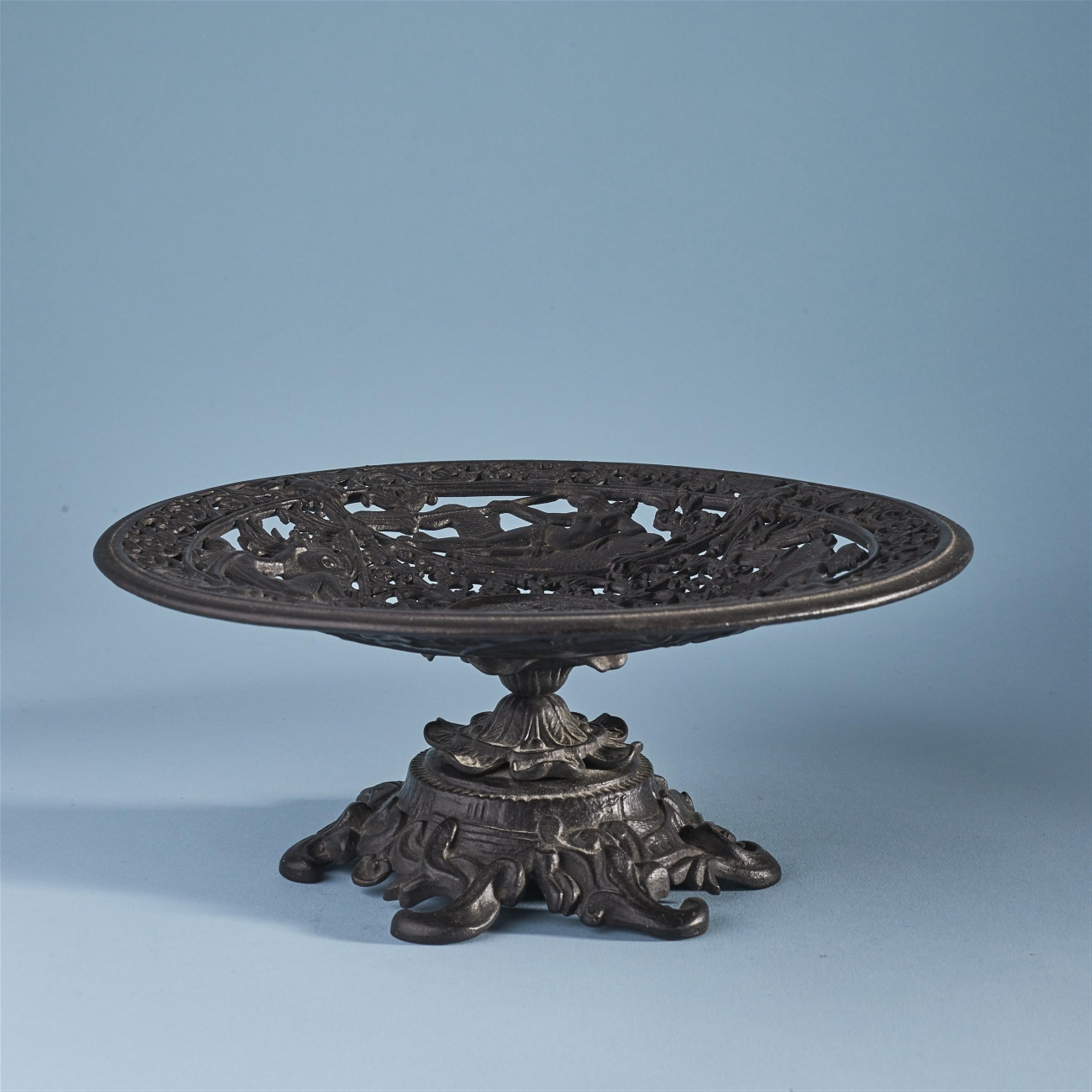A cast iron dish with sea gods - image-1