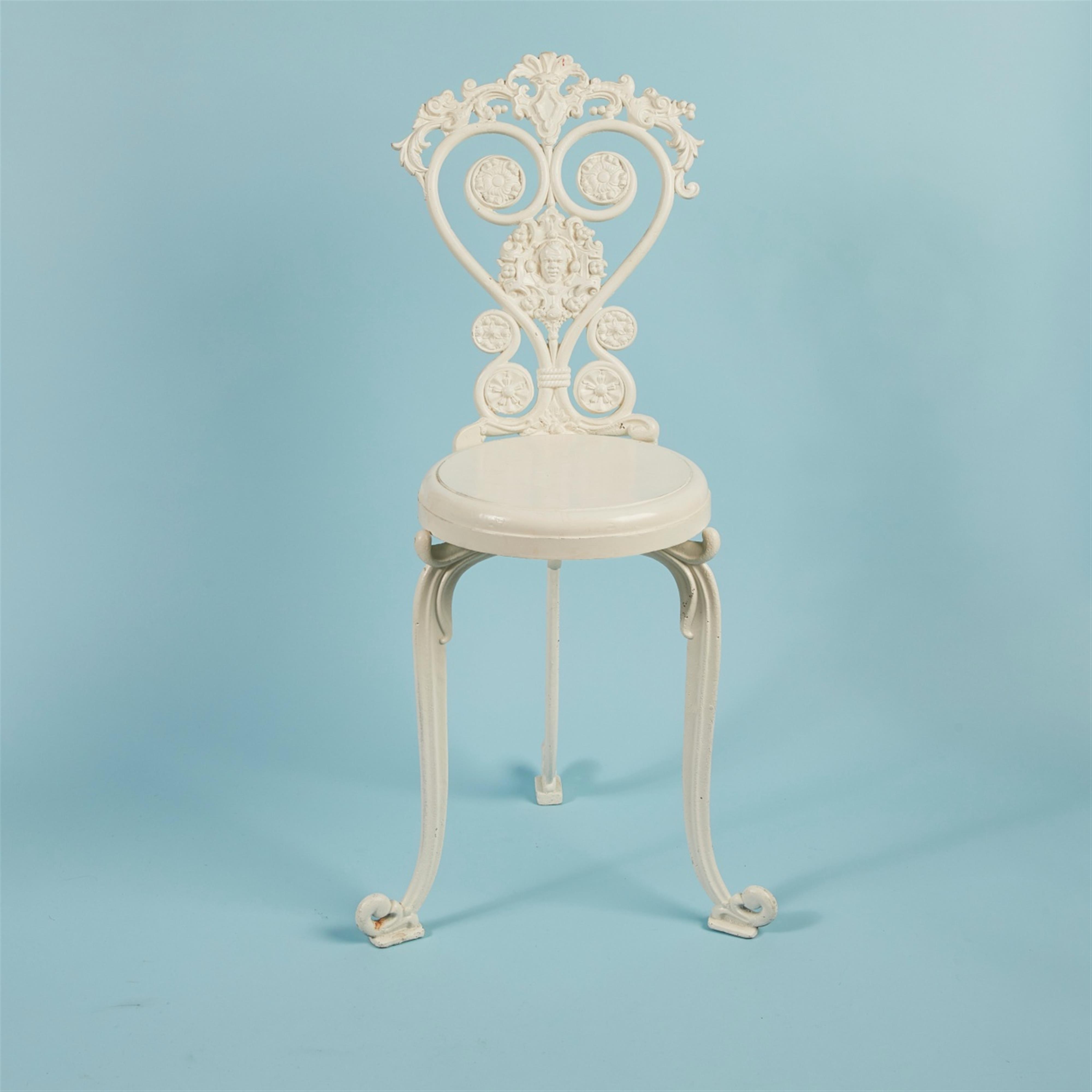 A cast iron garden stool - image-1