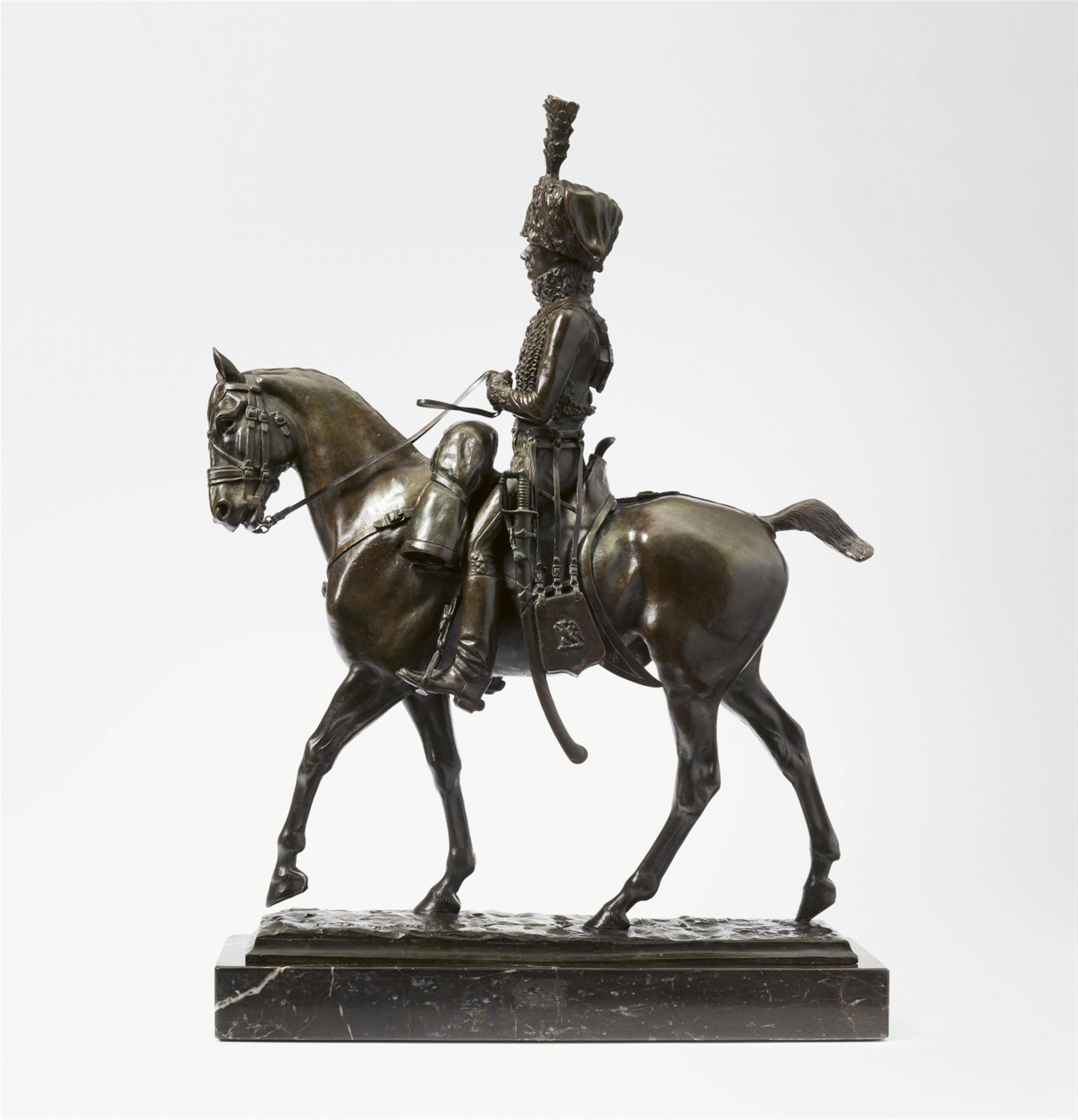 A bronze figure of a hussar on horseback - image-1