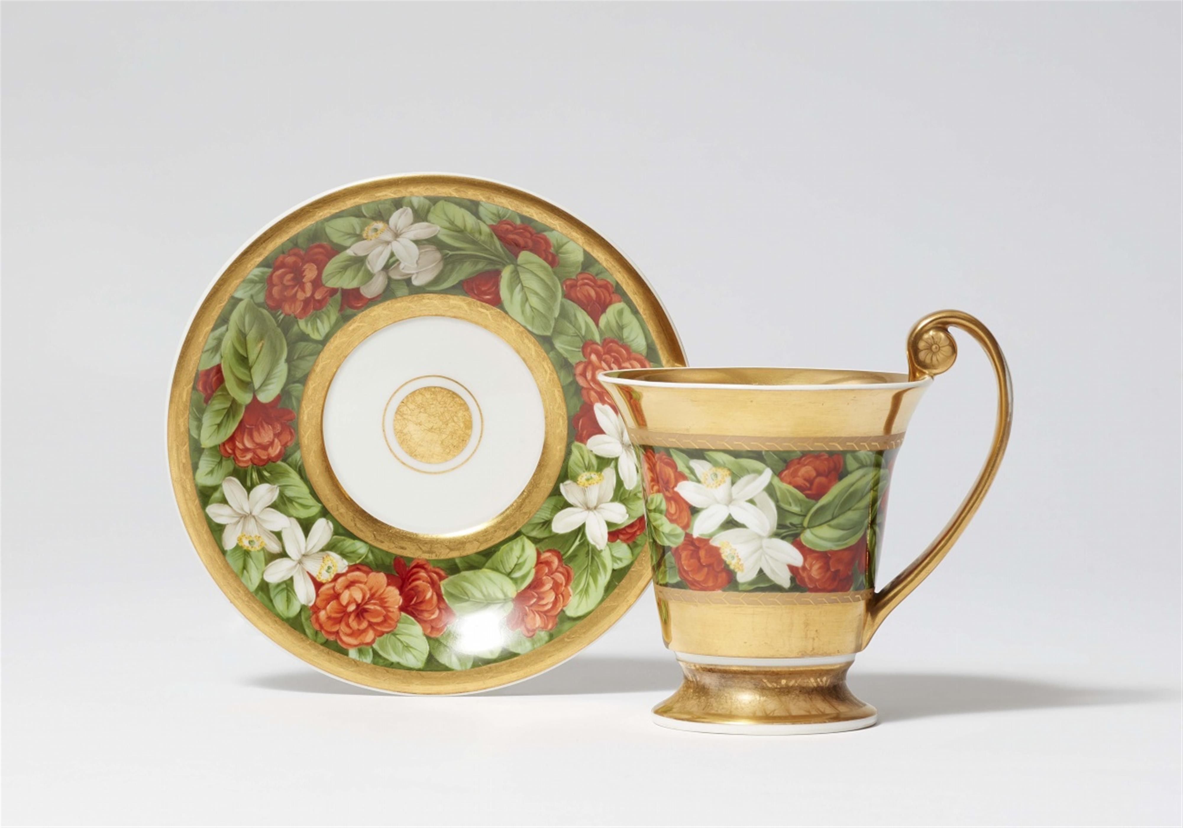 A Berlin KPM porcelain cup and saucer with floral decor - image-1