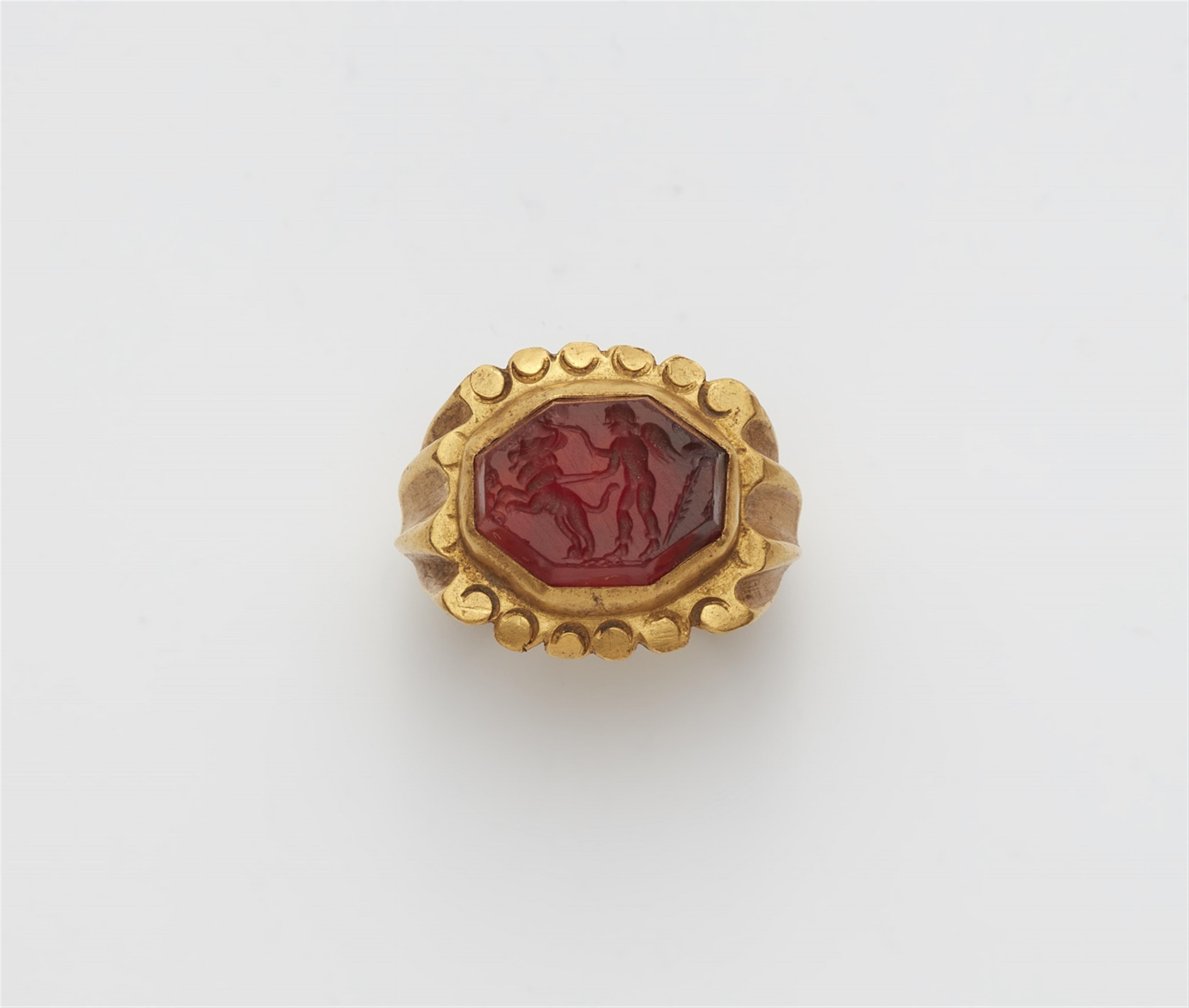 A 21k gold ring with a Roman intaglio - image-1