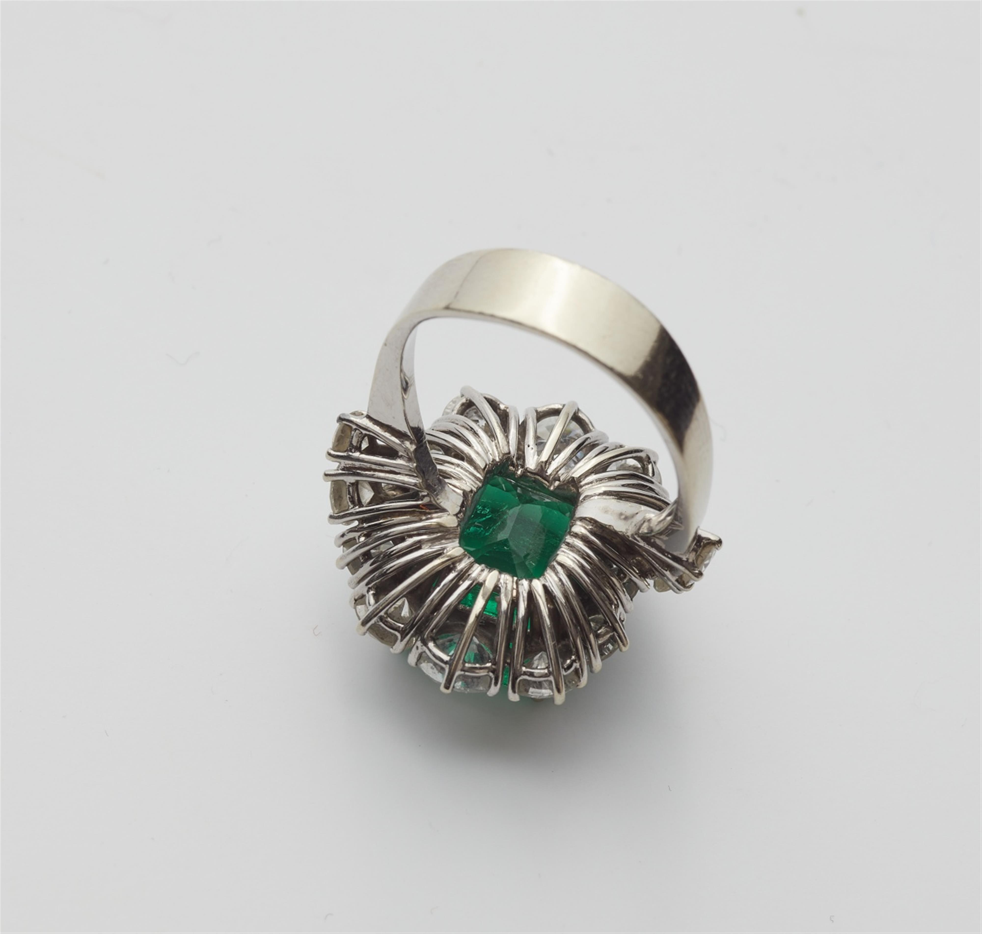 A diamond and emerald cocktail ring - image-3