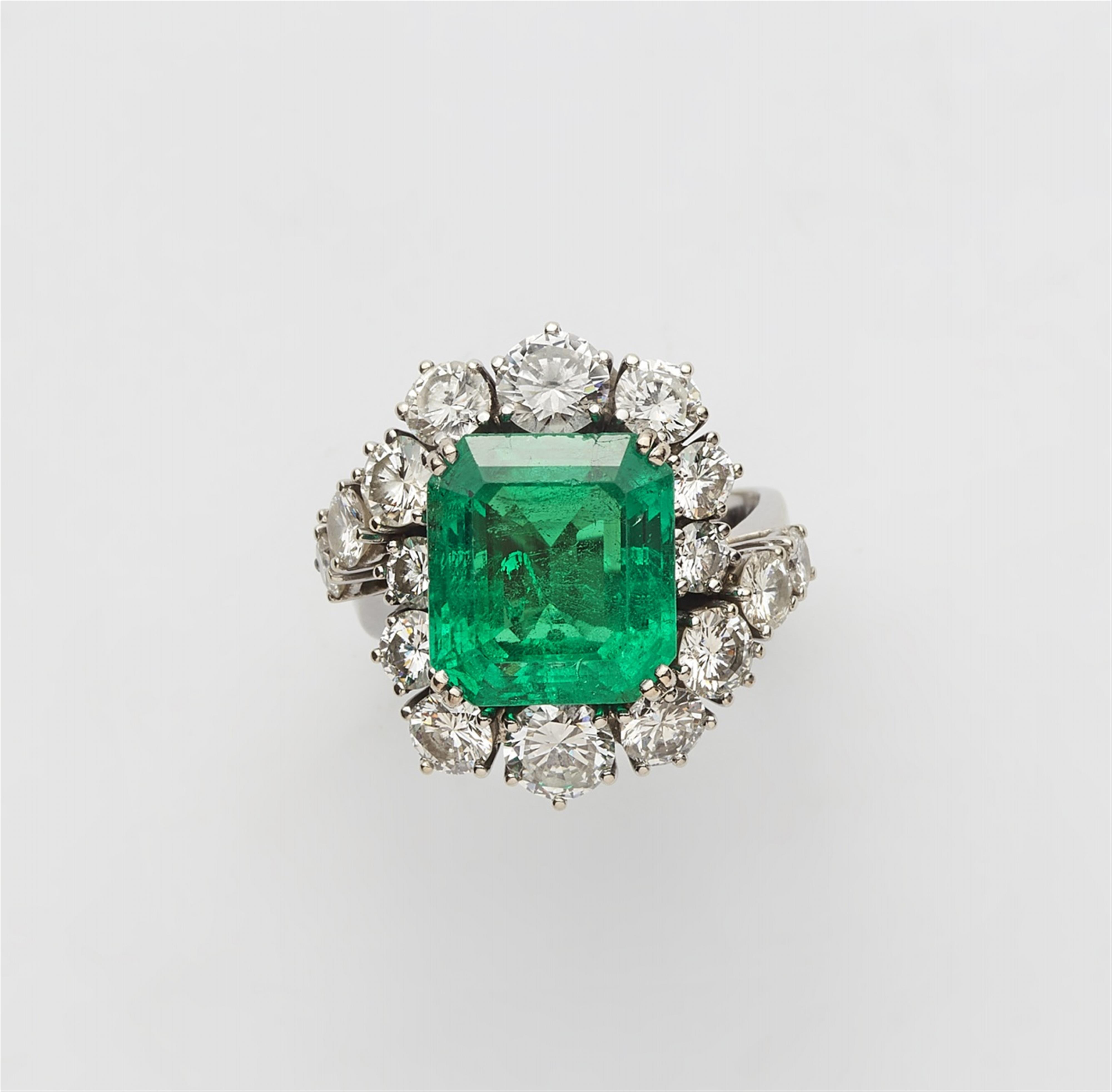 A diamond and emerald cocktail ring - image-1