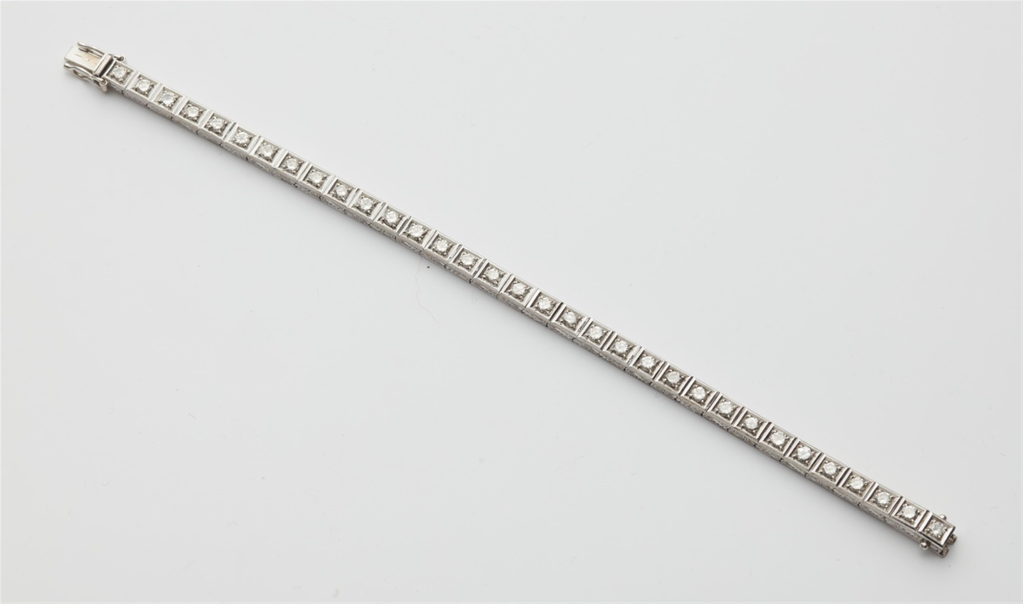 A 14k white gold diamond rivière bracelet - image-1