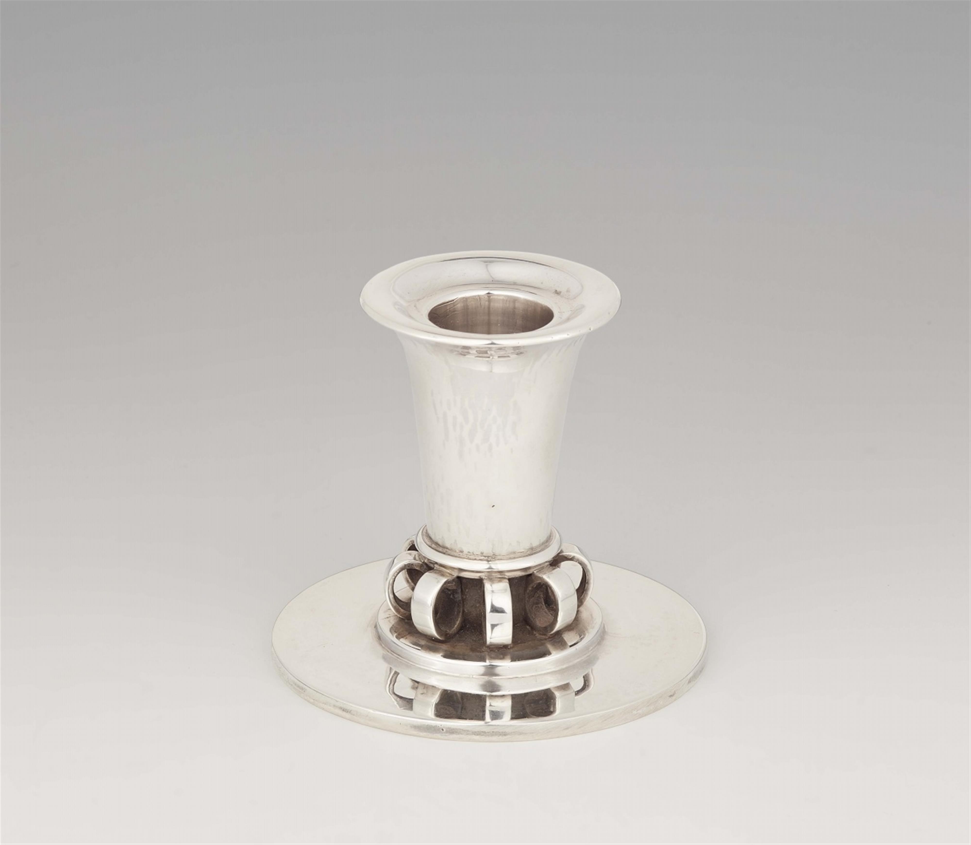 A Copenhagen silver candlestick by Georg Jensen, model no. 539 - image-1