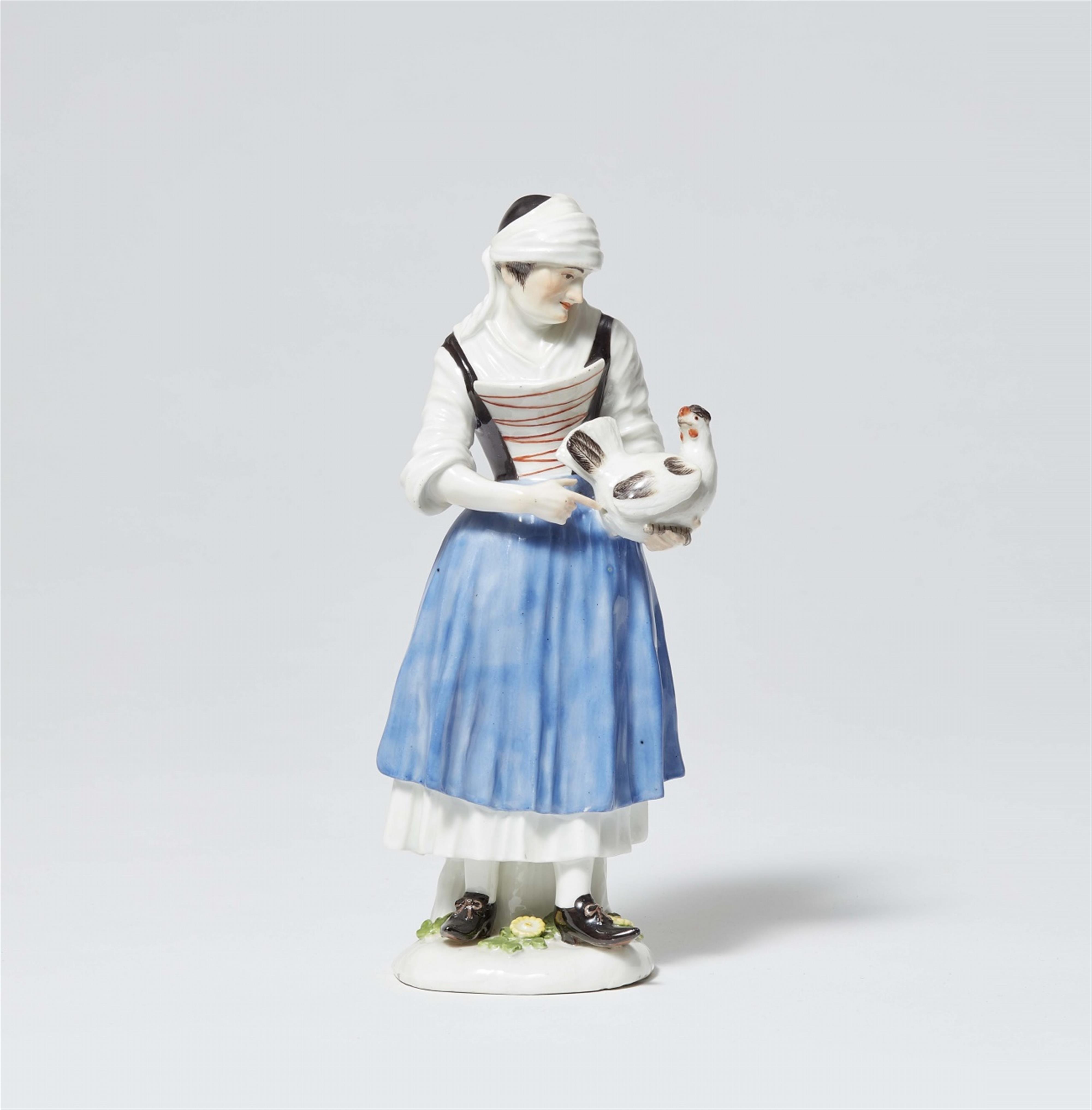 A Meissen porcelain figure of a peasant woman with a hen - image-1