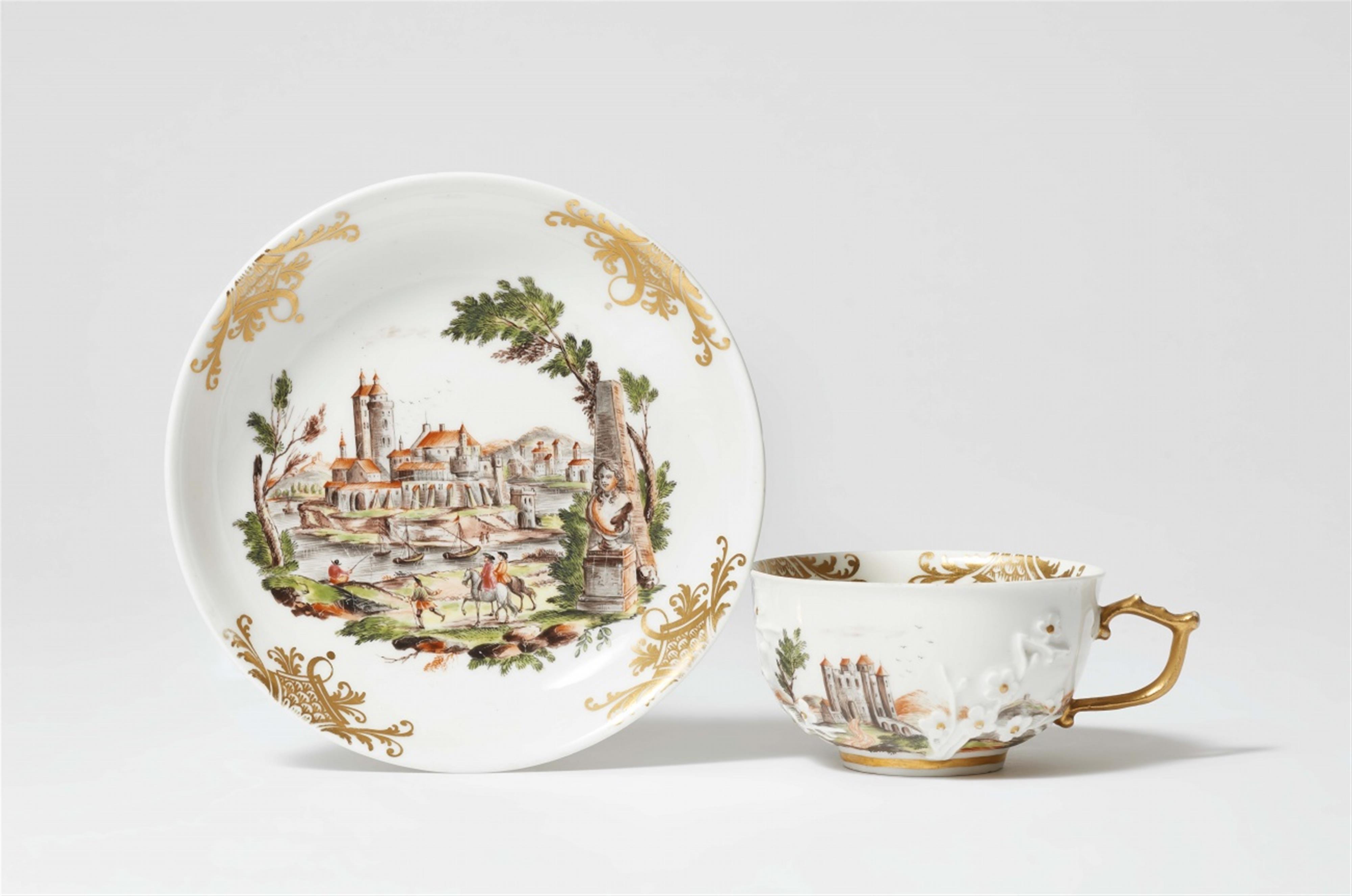 A Meissen porcelain cup and saucer with landscape motifs - image-1