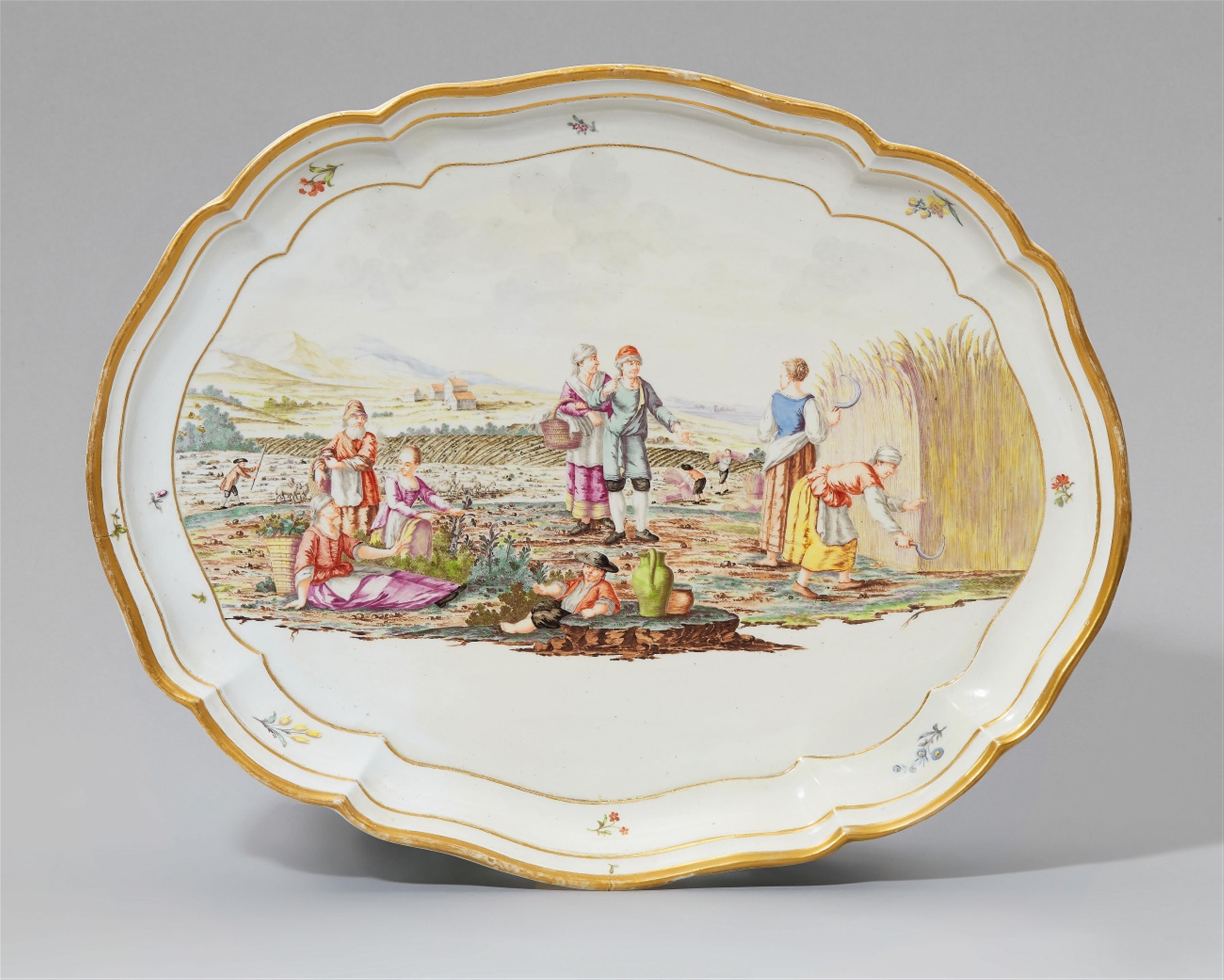An oval Nymphenburg porcelain platter with a harvest scene - image-1